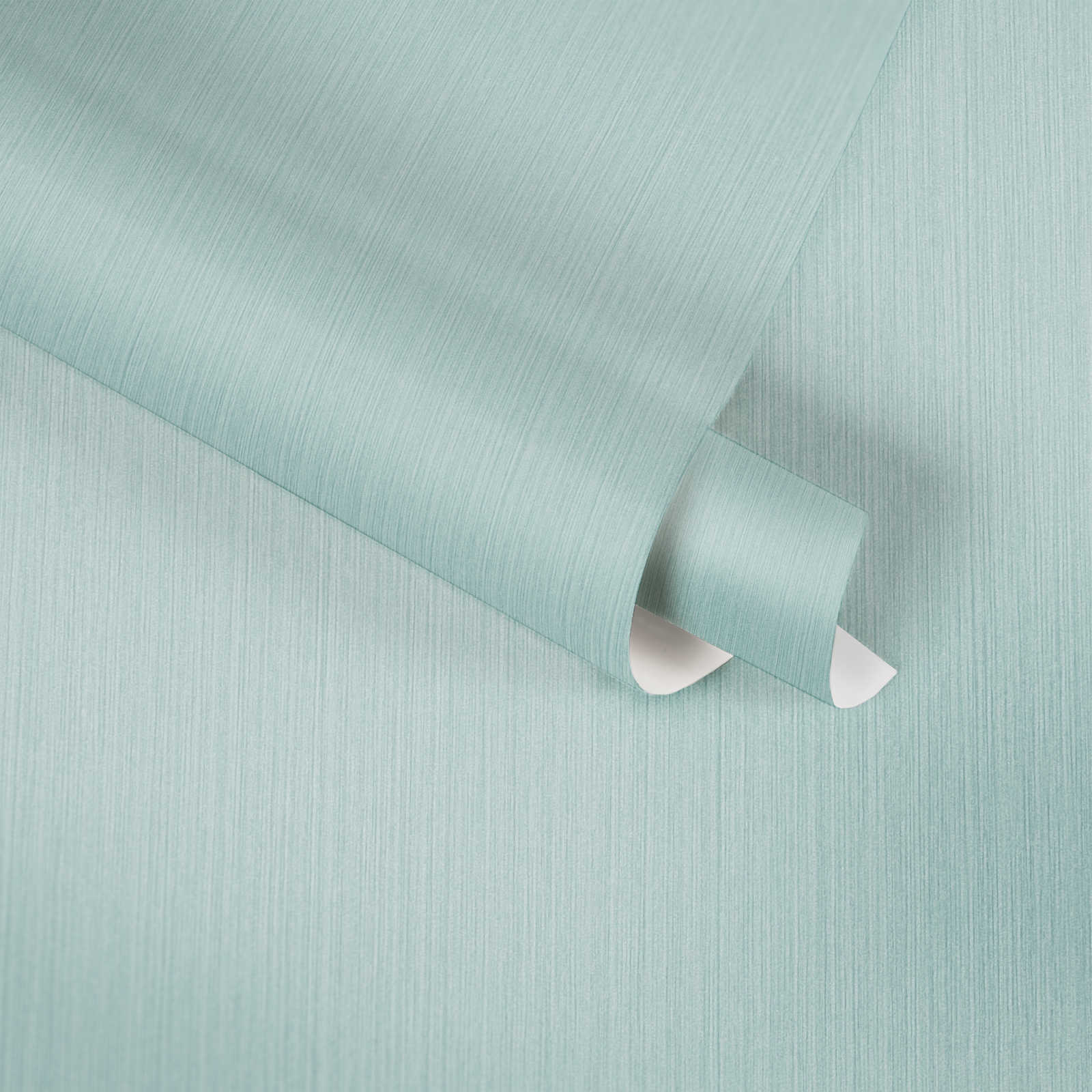             Papier peint uni bleu clair avec effet textile chiné de MICHALSKY
        