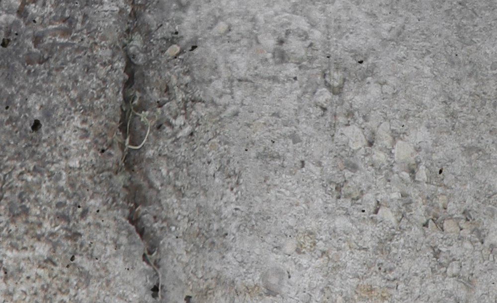             Carta da parati con crepe di cemento - Parete di cemento dall'aspetto usato
        