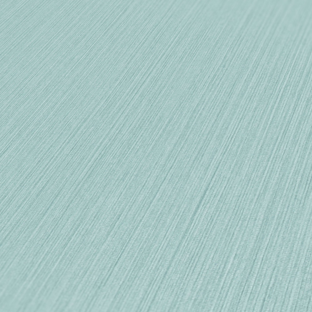             Papier peint uni bleu clair avec effet textile chiné de MICHALSKY
        
