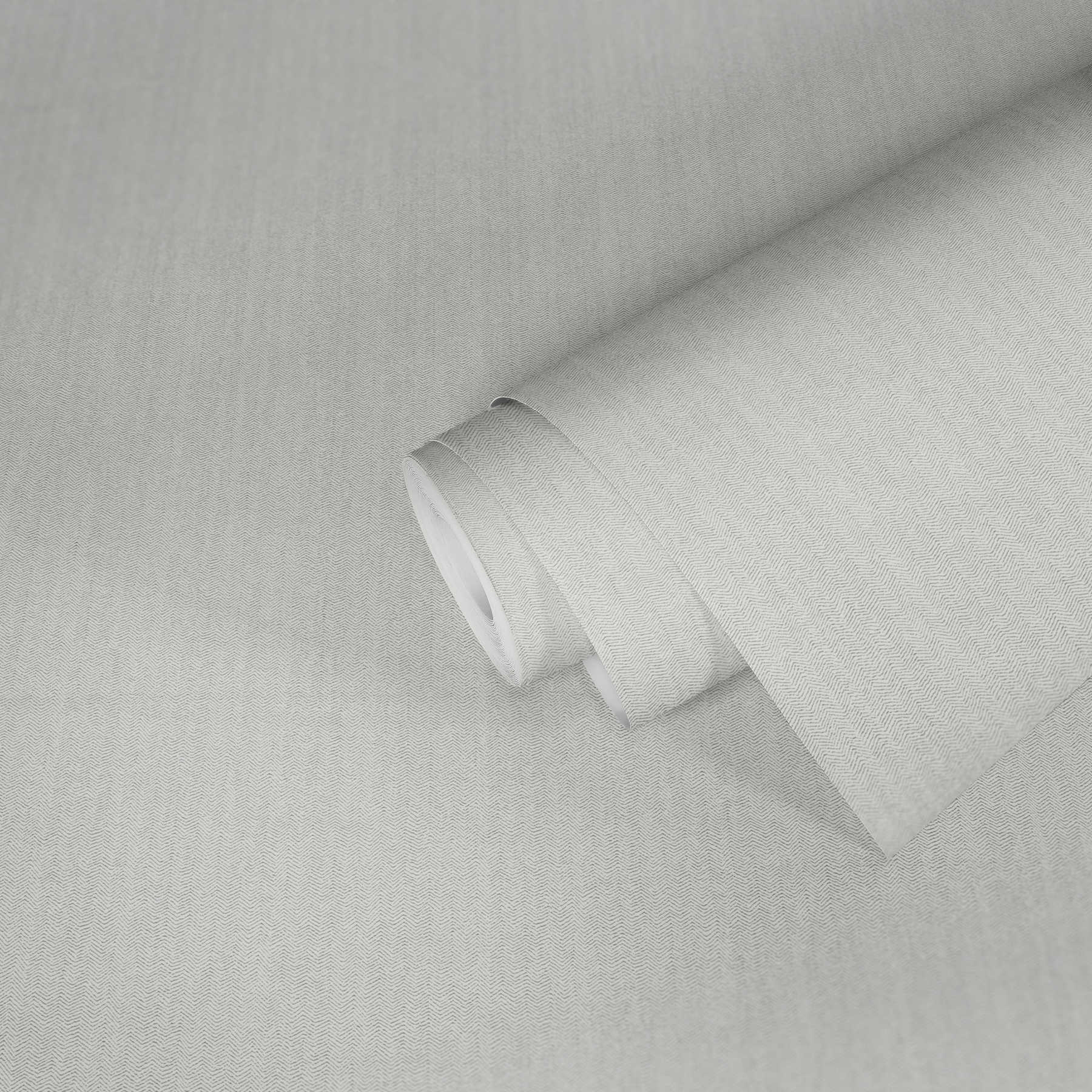             Papier peint uni structure à chevrons avec effet textile
        