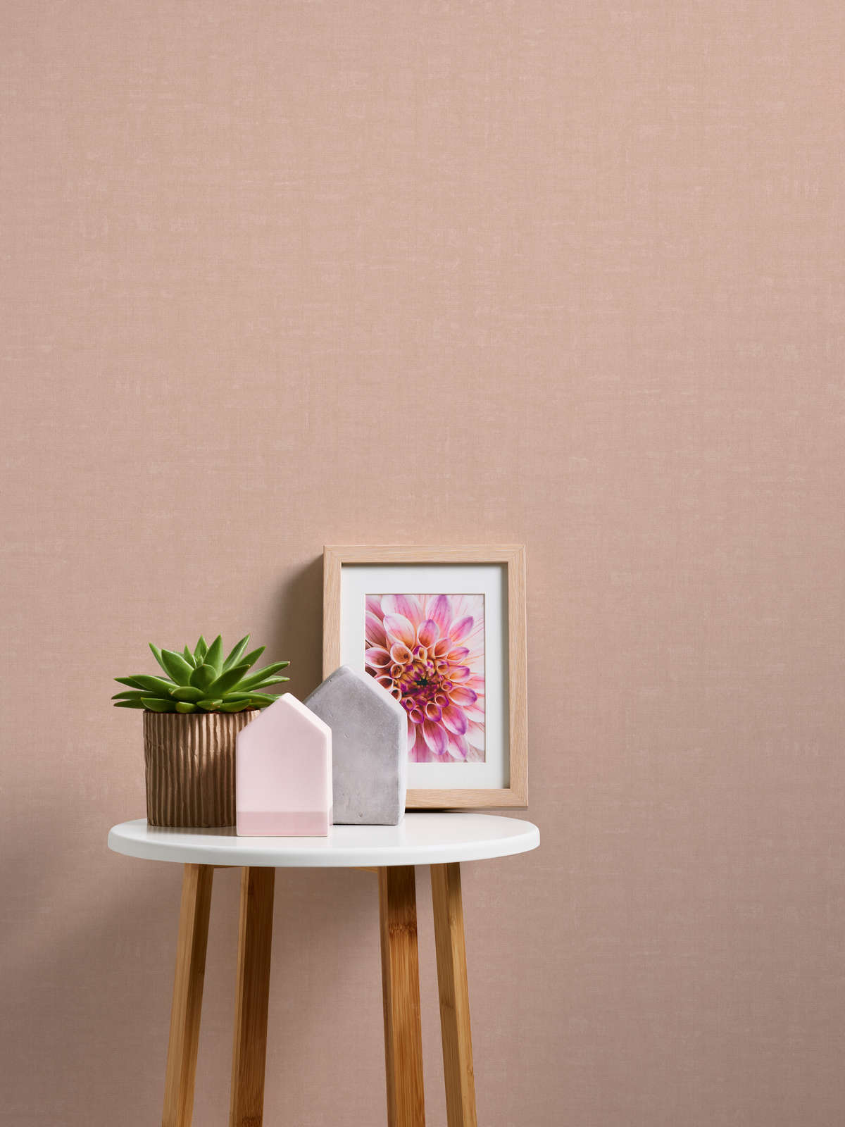             Pink wallpaper plain and mottled with texture embossing
        