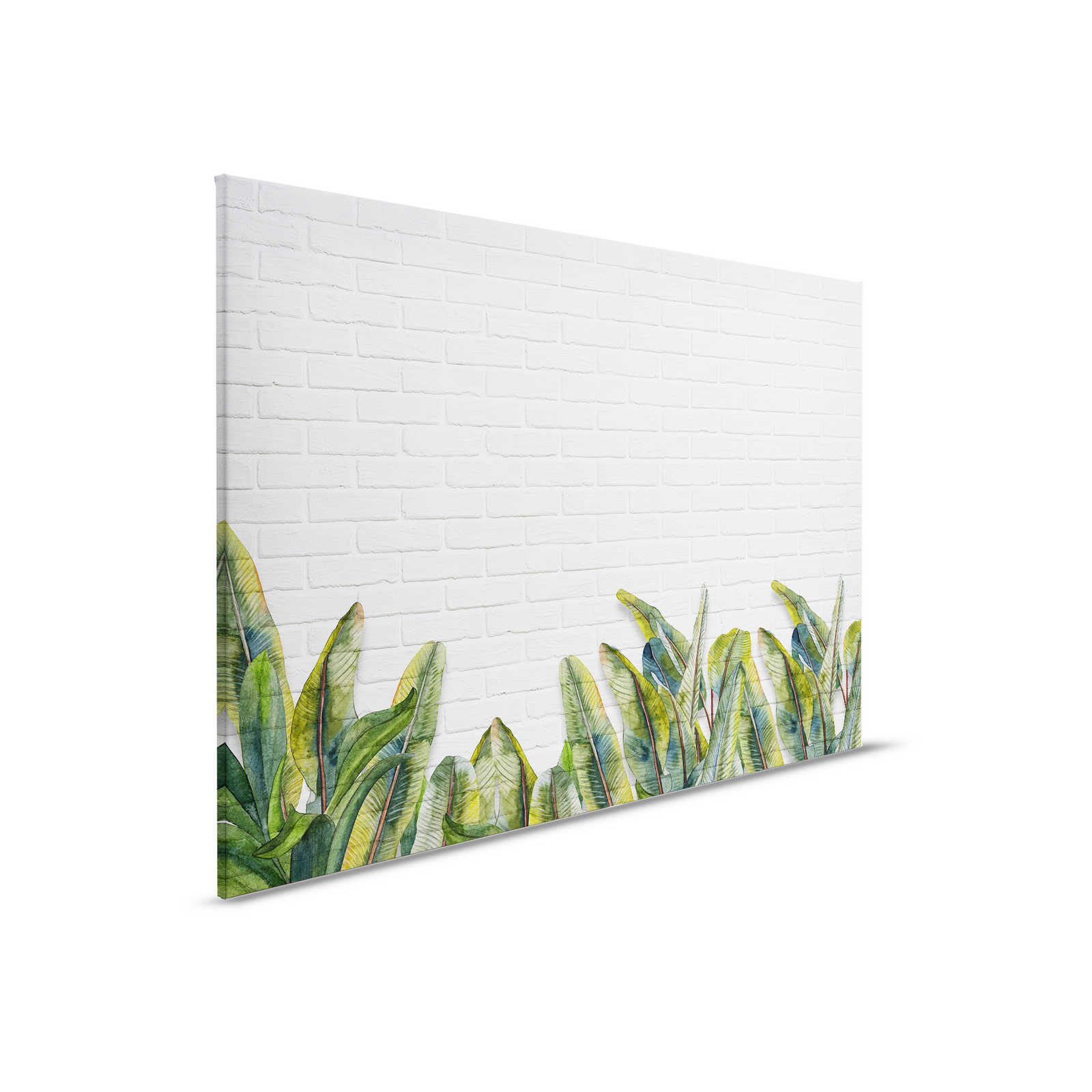 Quadro su tela con foglie davanti a una parete di mattoni bianchi - 0,90 m x 0,60 m
