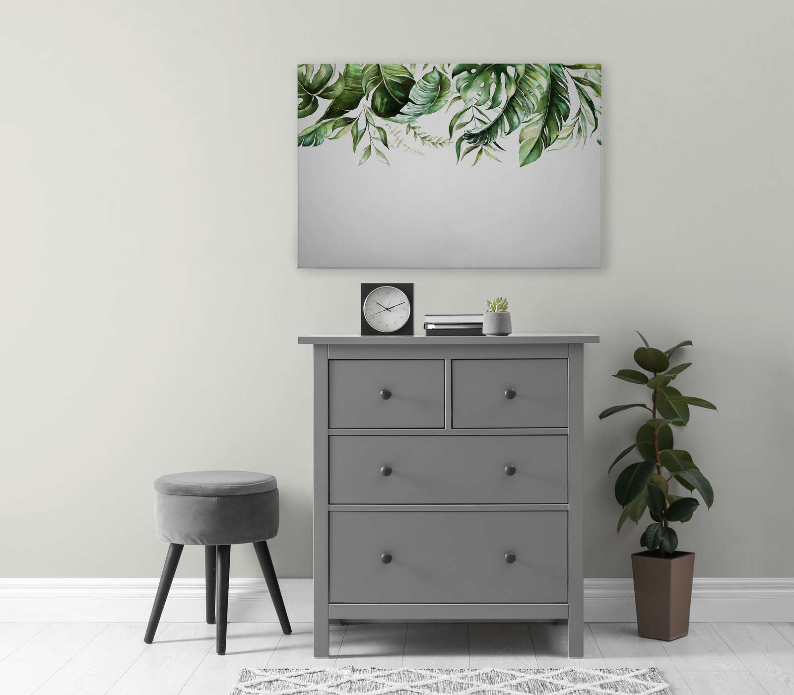             Canvas schilderij met tropische bladranken op een muur - 0.90 m x 0.60 m
        