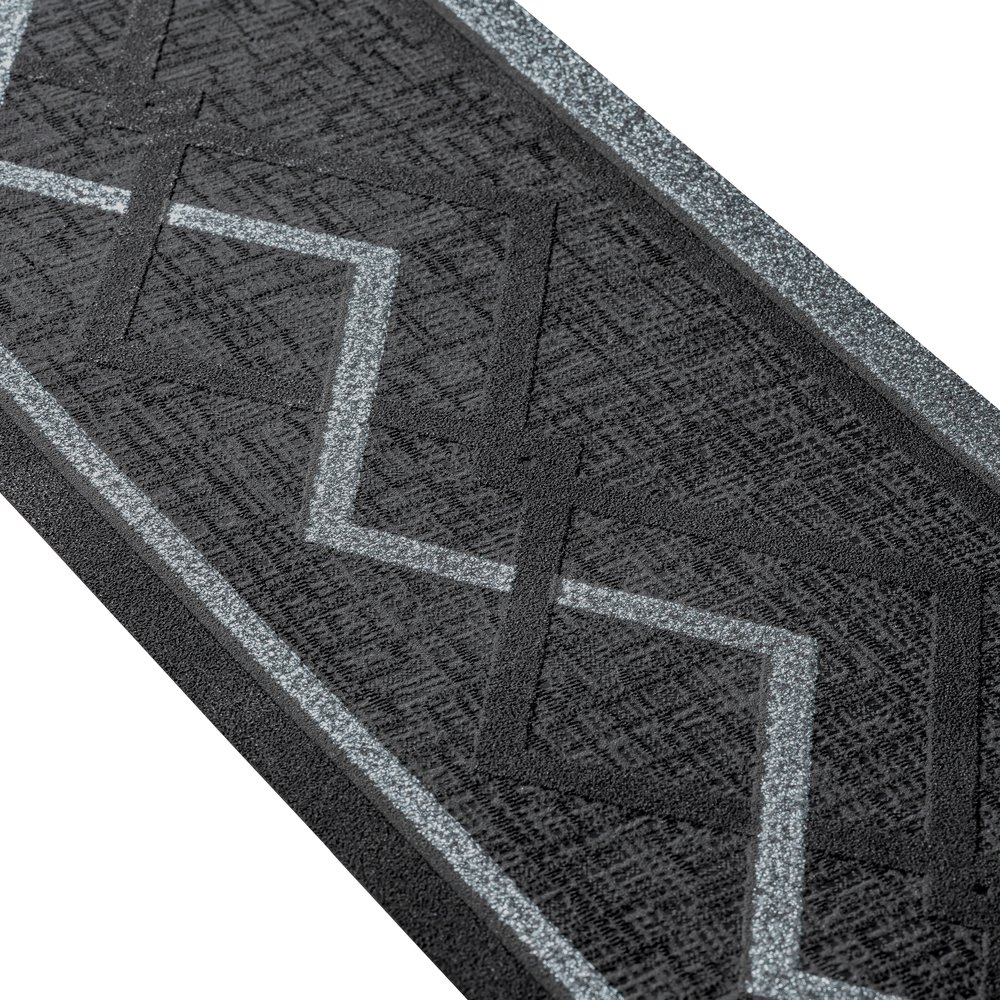             Bordo grigio-nero con disegno a zig-zag e glitter argento
        