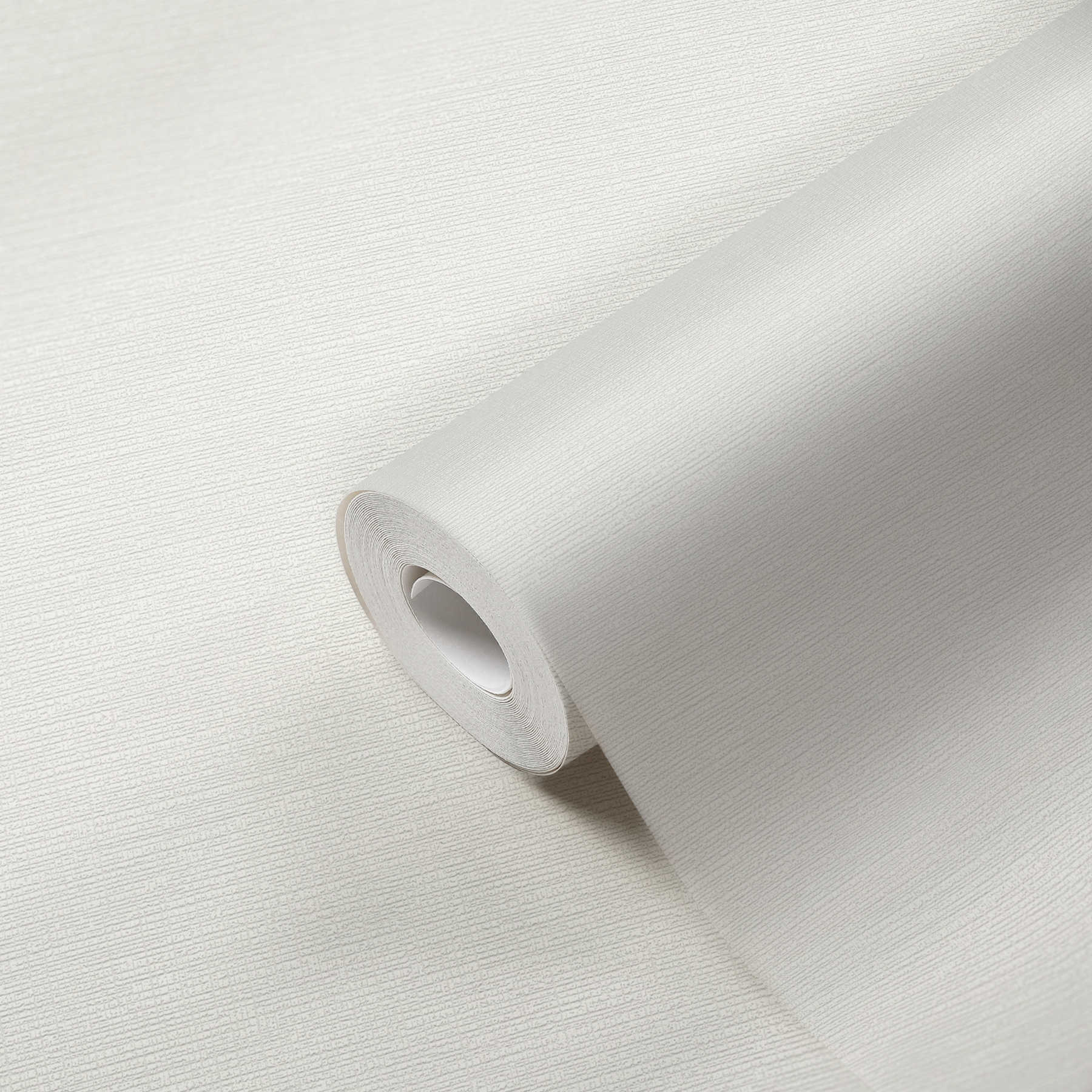             Papel pintado no tejido blanco con estructura retro y efecto textil
        