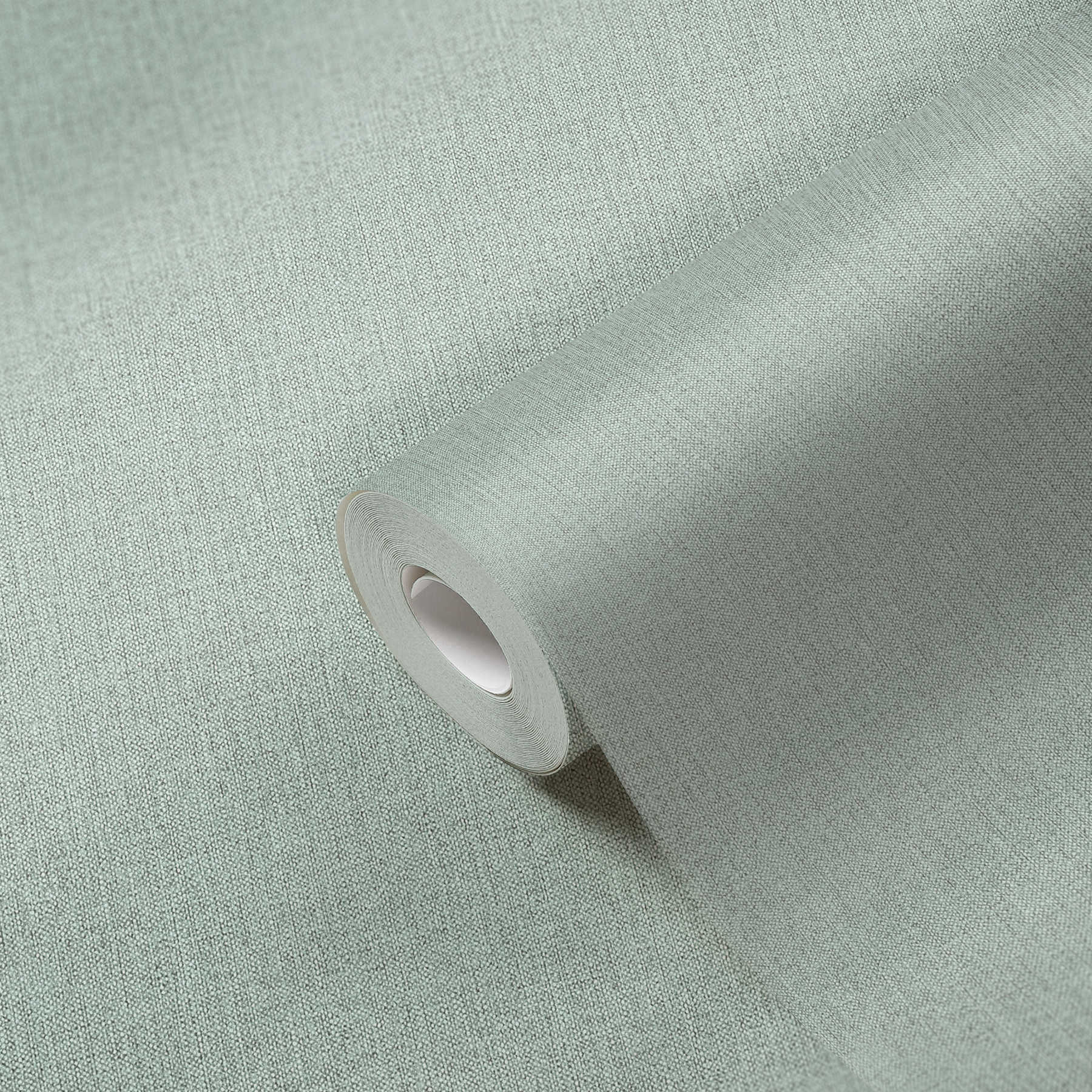             Carta da parati in tessuto non tessuto verde acqua screziata con struttura tessile
        