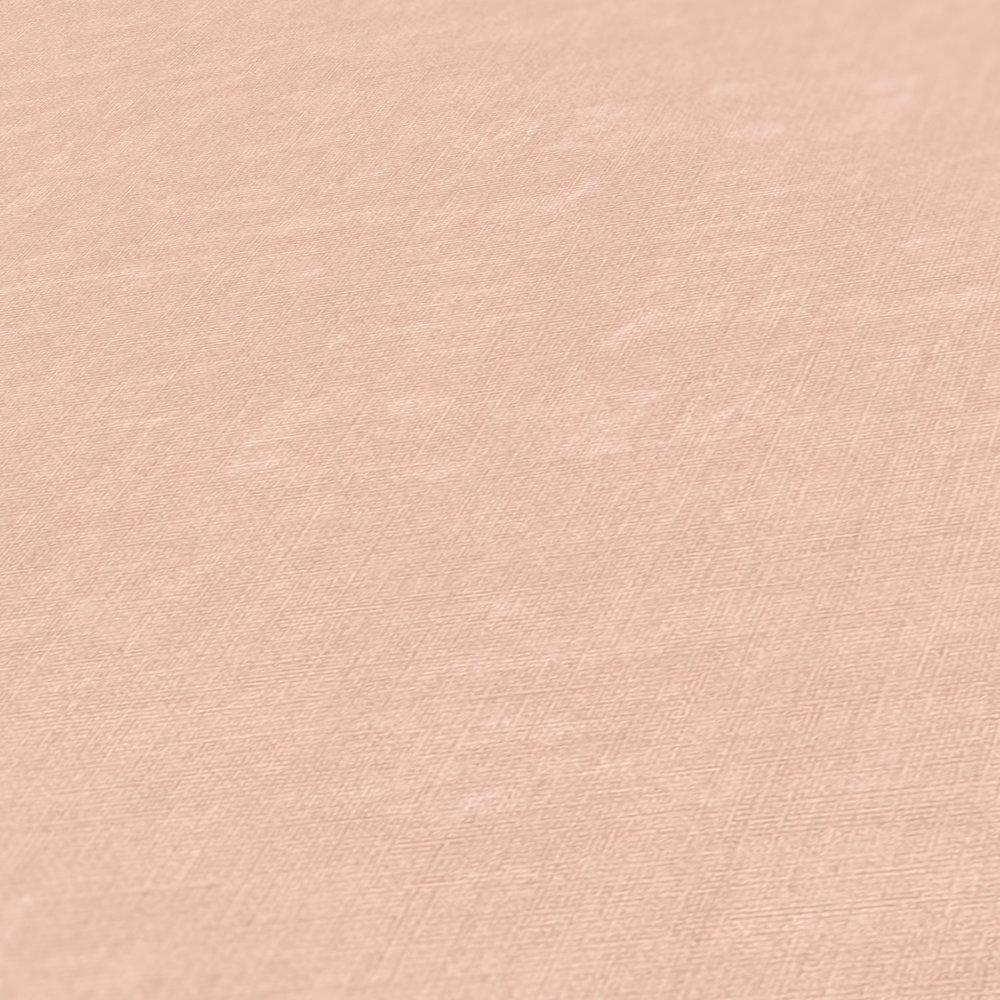             Papier peint rose uni et chiné avec gaufrage structuré
        