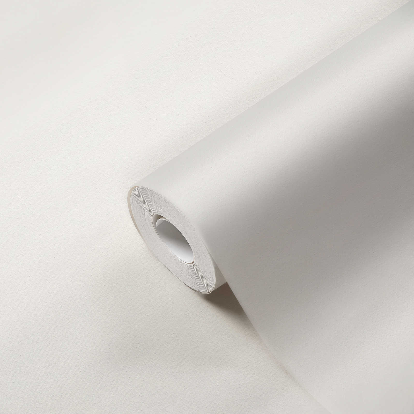             Papier peint blanc uni avec texture tissée & effet structuré
        