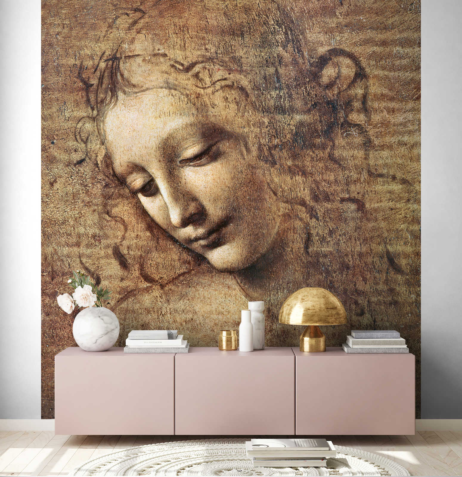             Muurschildering "Hoofd van een jonge vrouw met verward haar" van Leonardo da Vinci
        