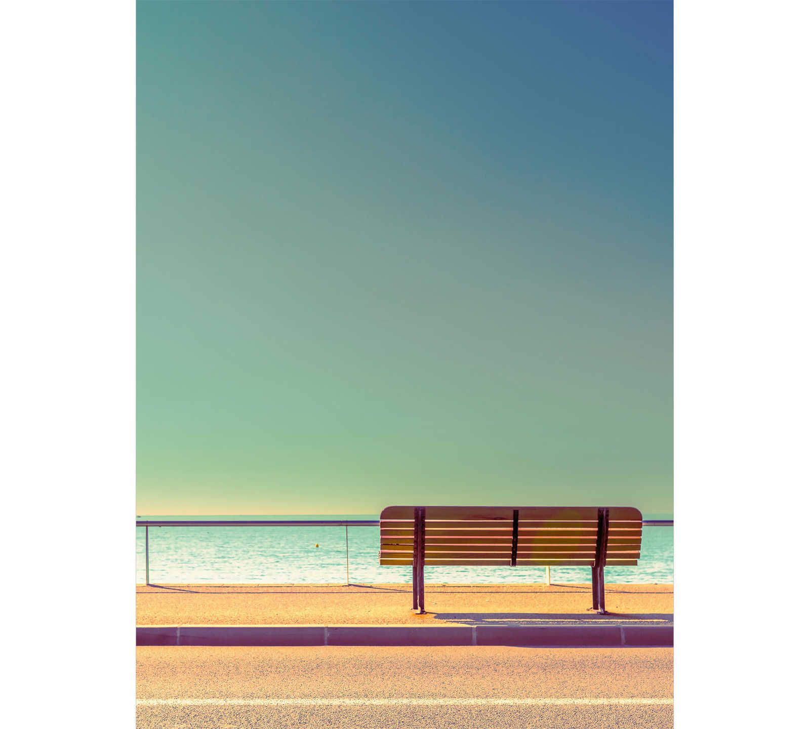 Photo wallpaper street with bench by the sea - cream, yellow
