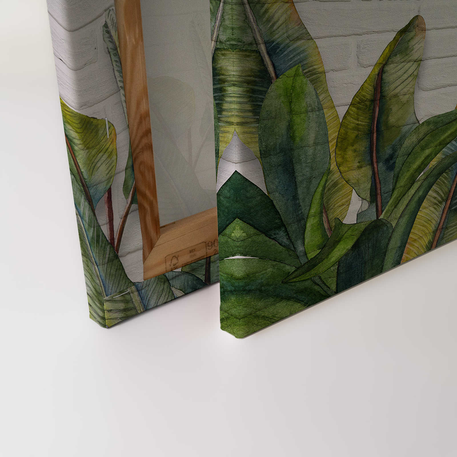             Quadro su tela con foglie davanti a una parete di mattoni bianchi - 0,90 m x 0,60 m
        