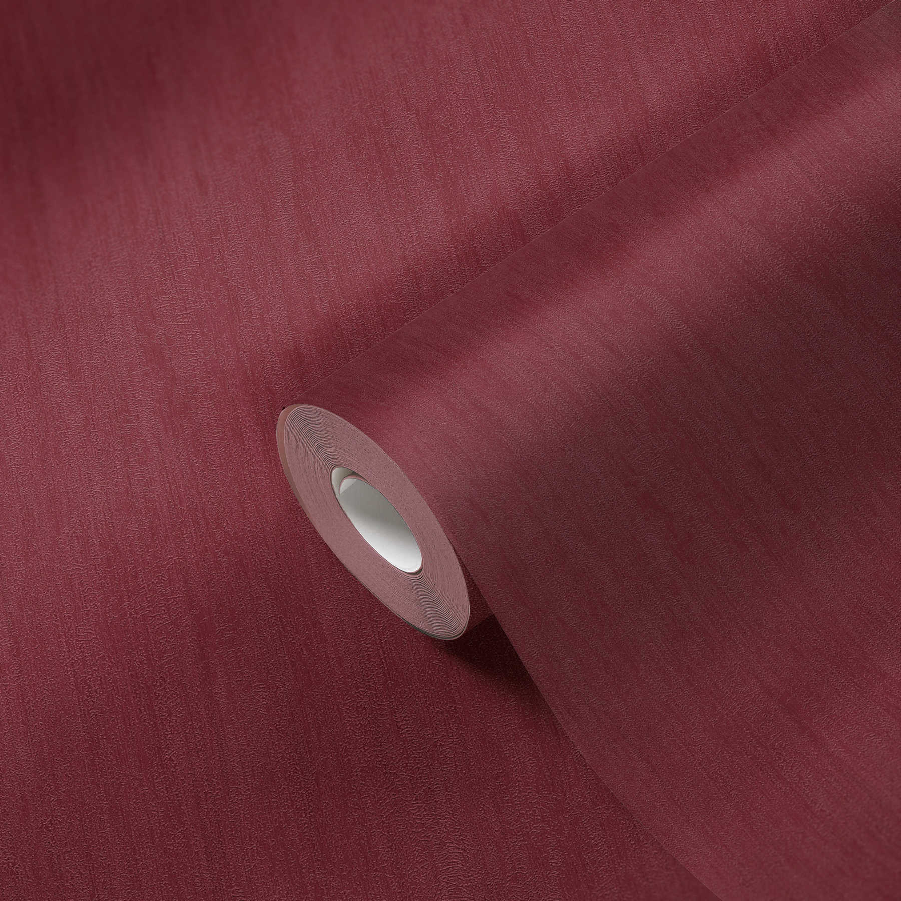             papier peint bordeaux uni chiné aspect plâtre texture gaufrée
        