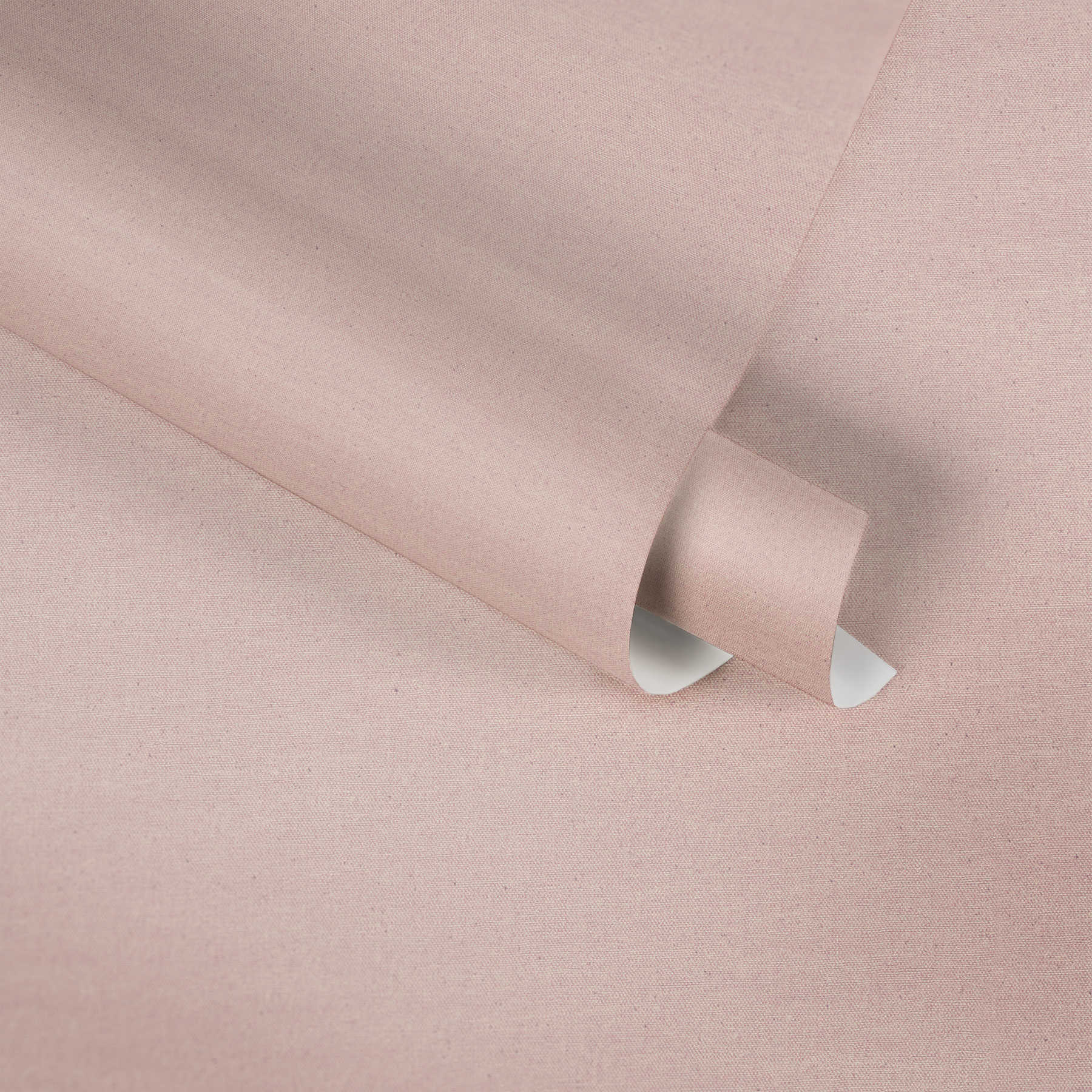             Papier peint uni rose design textile avec pois gris
        