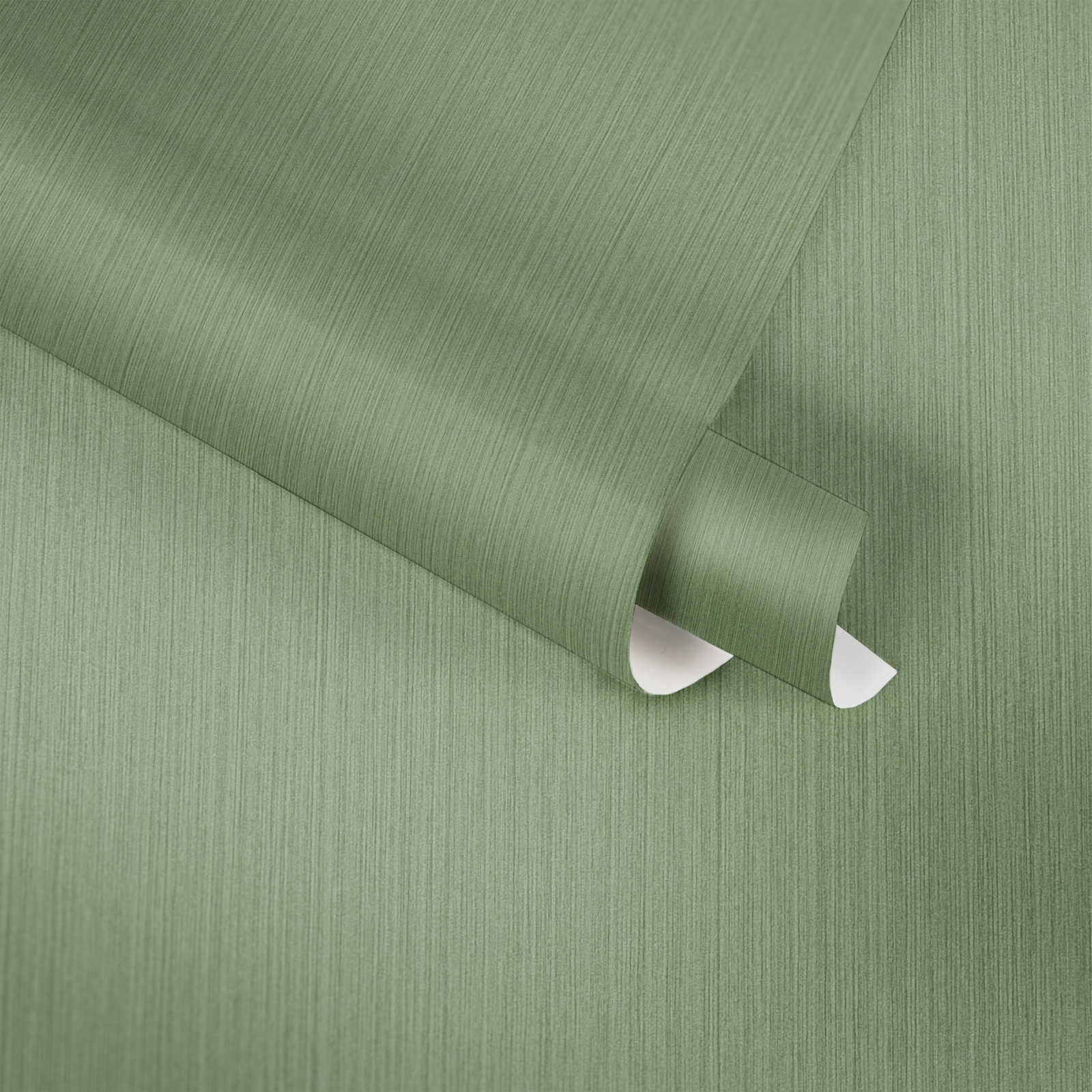             Papier peint uni vert avec effet textile chiné de MICHALSKY
        