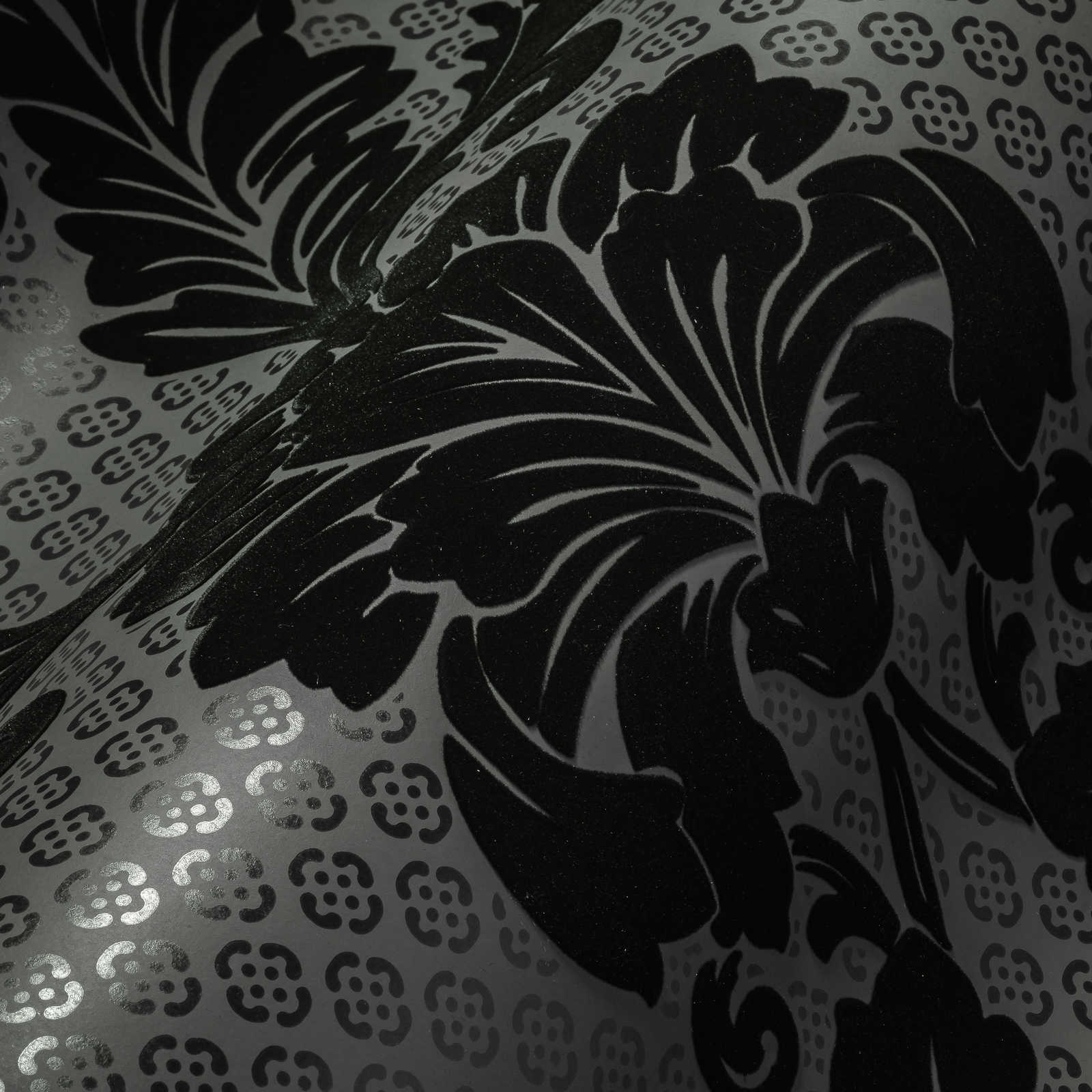             Patterned ornamental wallpaper with large floral motif - black, grey
        