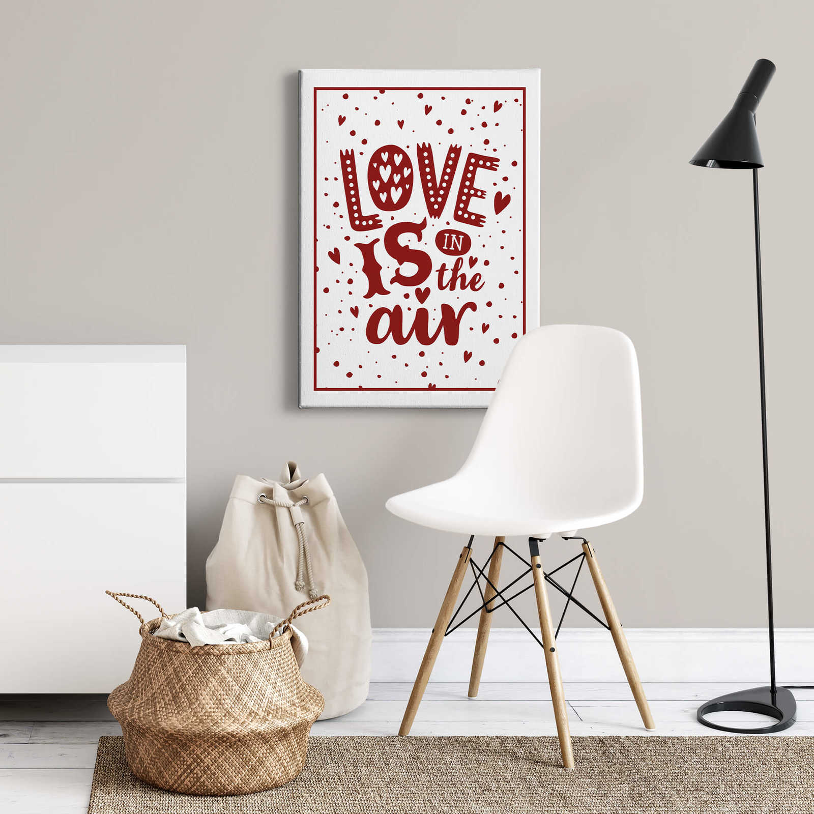             Canvas print saying love is in the air – red
        