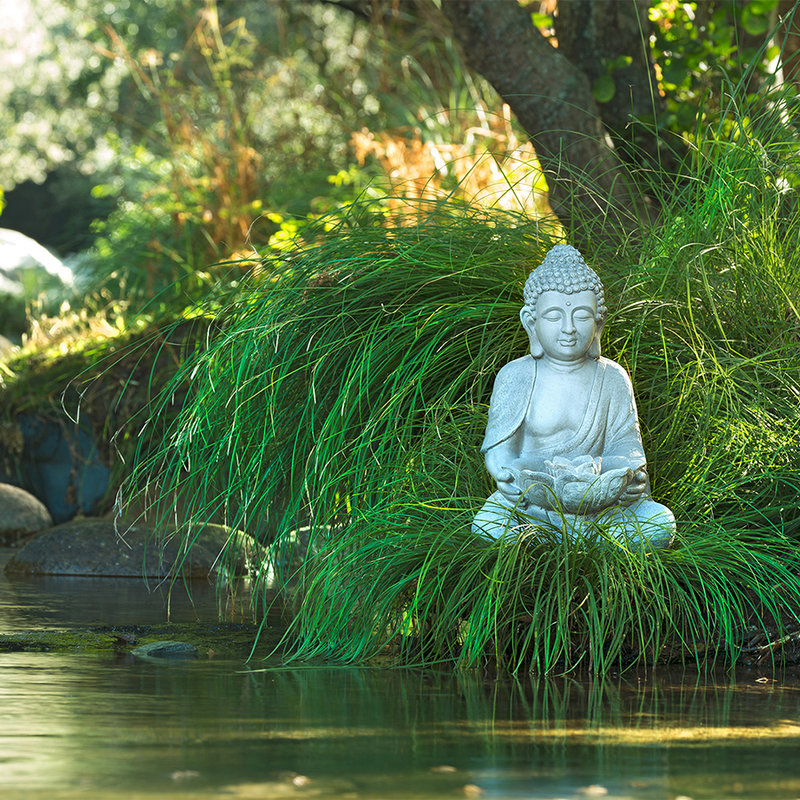 Photo wallpaper Buddha Statue on the Riverbank - Mother of Pearl Smooth Non-woven
