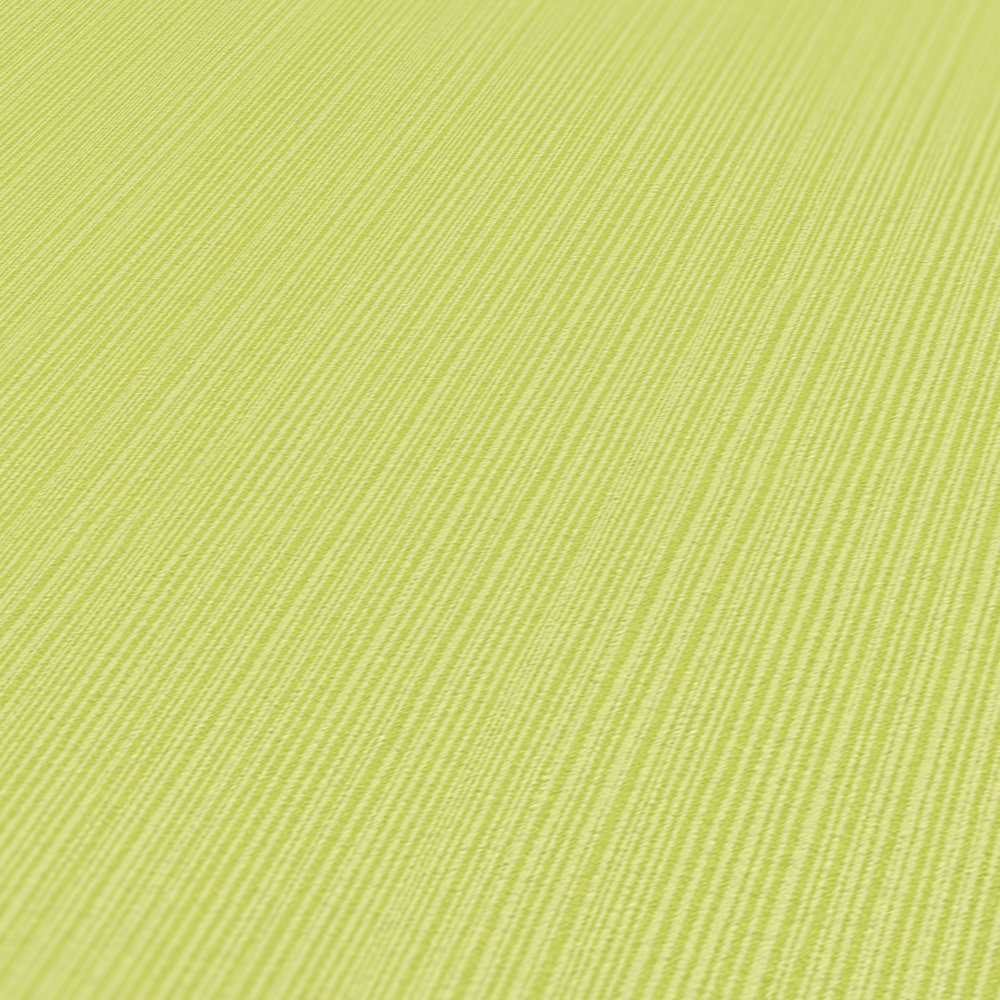             Carta da parati verde lime uni, con effetto texture a righe
        