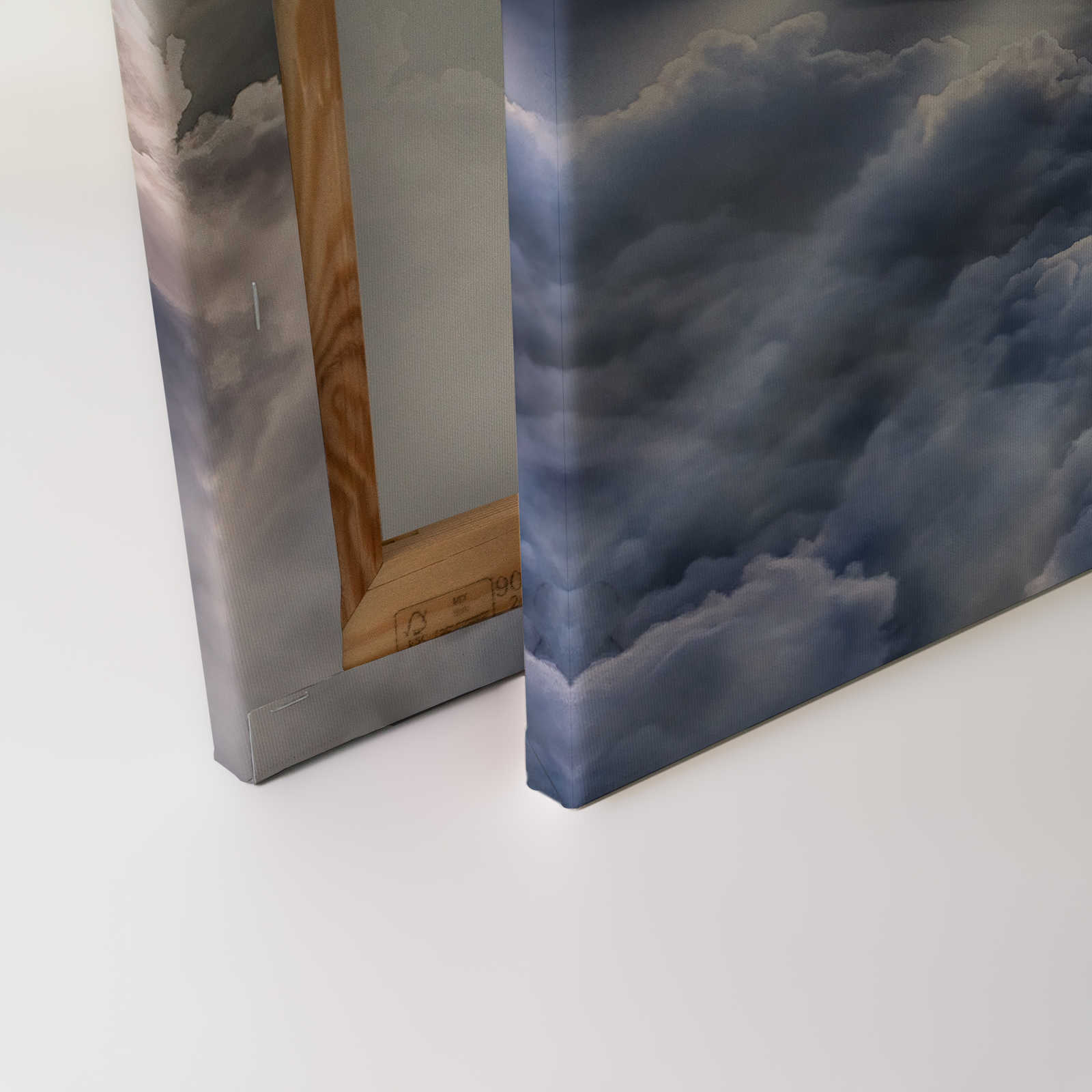             Canvas schilderij Lucht met zon en wolken | oranje, grijs, blauw - 0,90 m x 0,60 m
        