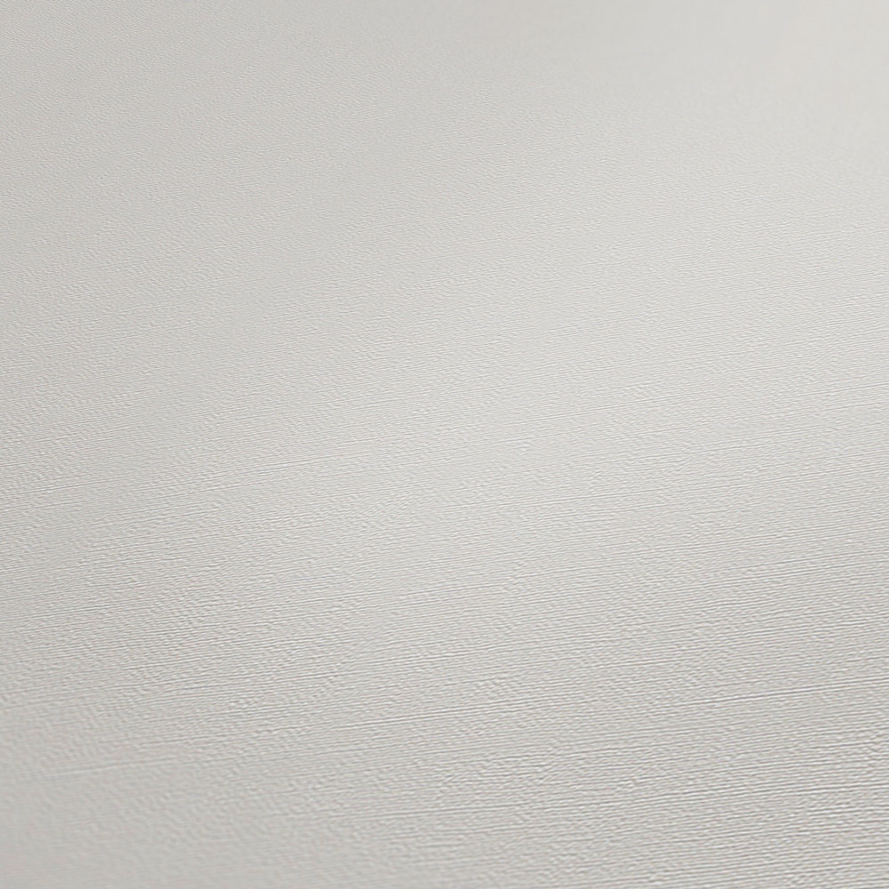             Non-woven wallpaper cream-white with natural textile look
        