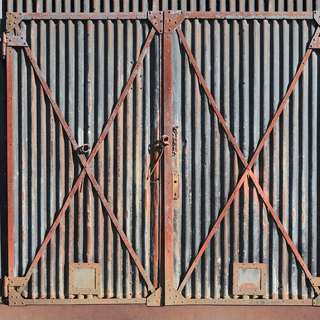         Photo wallpaper steel gate rusty in industrial style
    