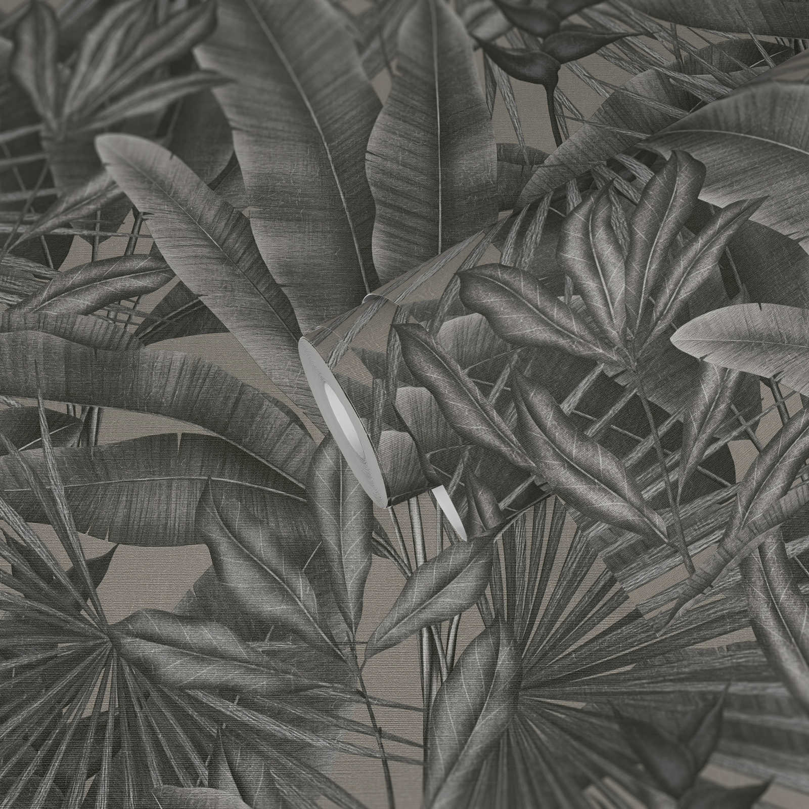             Vliesbehang met bladmotief in jungledessin - grijs, beige, zwart
        