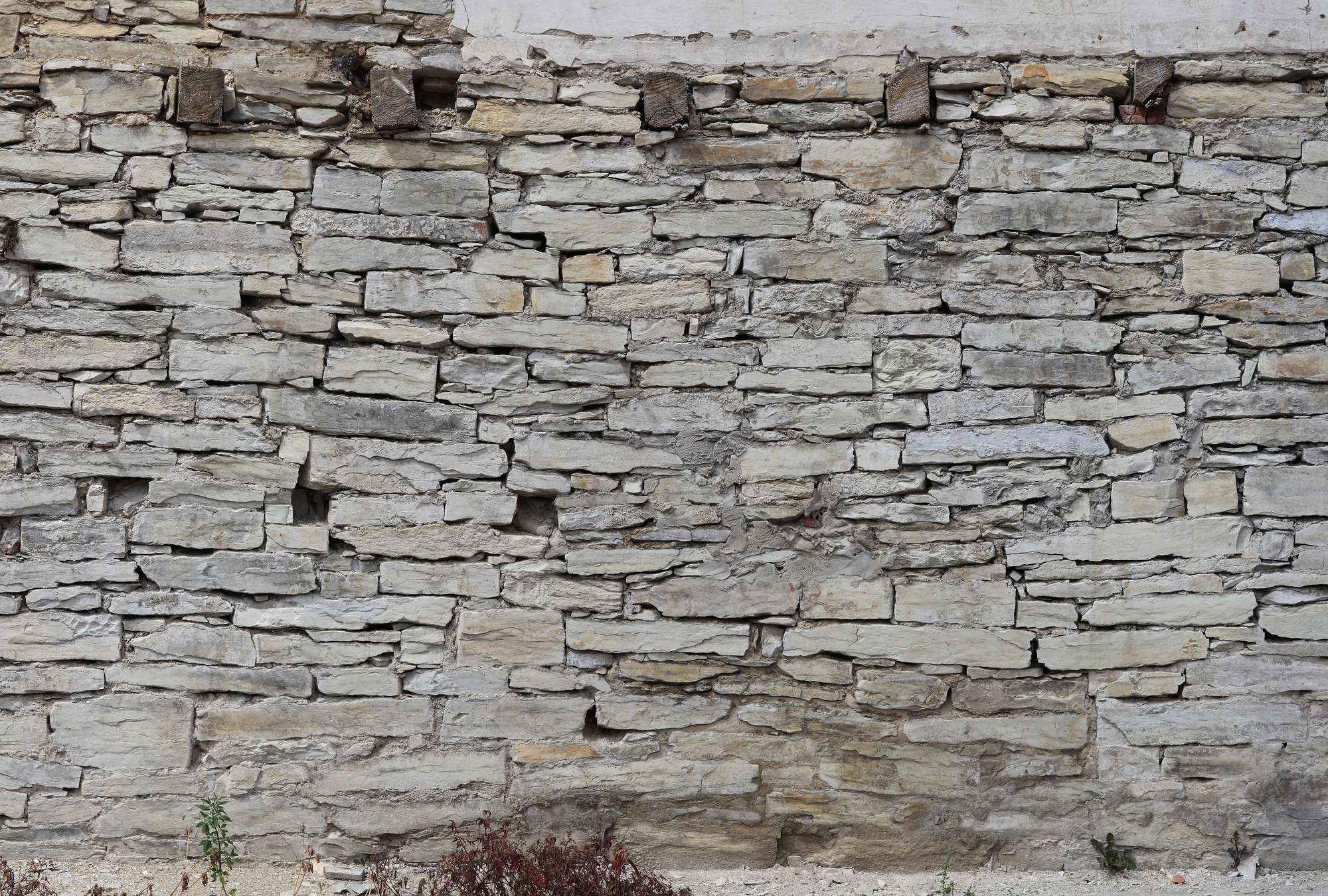             Papier peint panoramique imitation pierre avec mur de pierres sèches clair
        