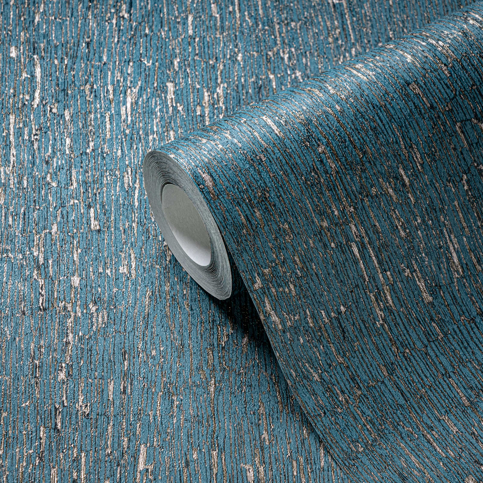             Non-woven wallpaper in plaster look with gold accents - blue, petrol, silver
        