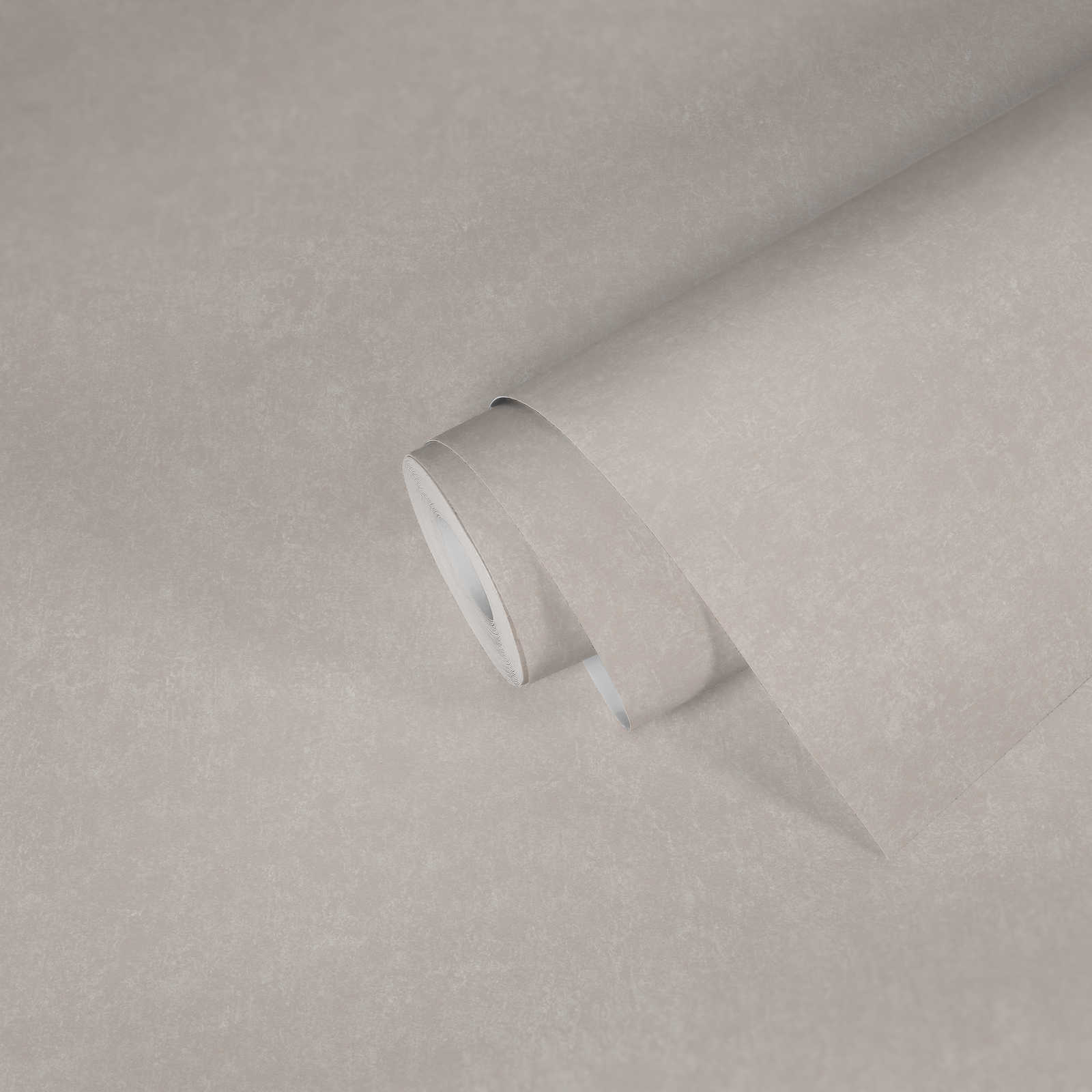             Papier peint crème uni avec effet structuré
        