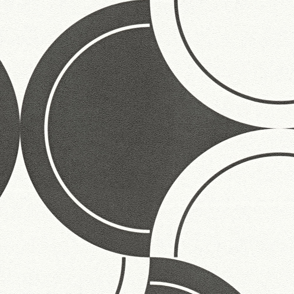             Papier peint intissé motif rétro avec cercles style années 70 - noir et blanc
        