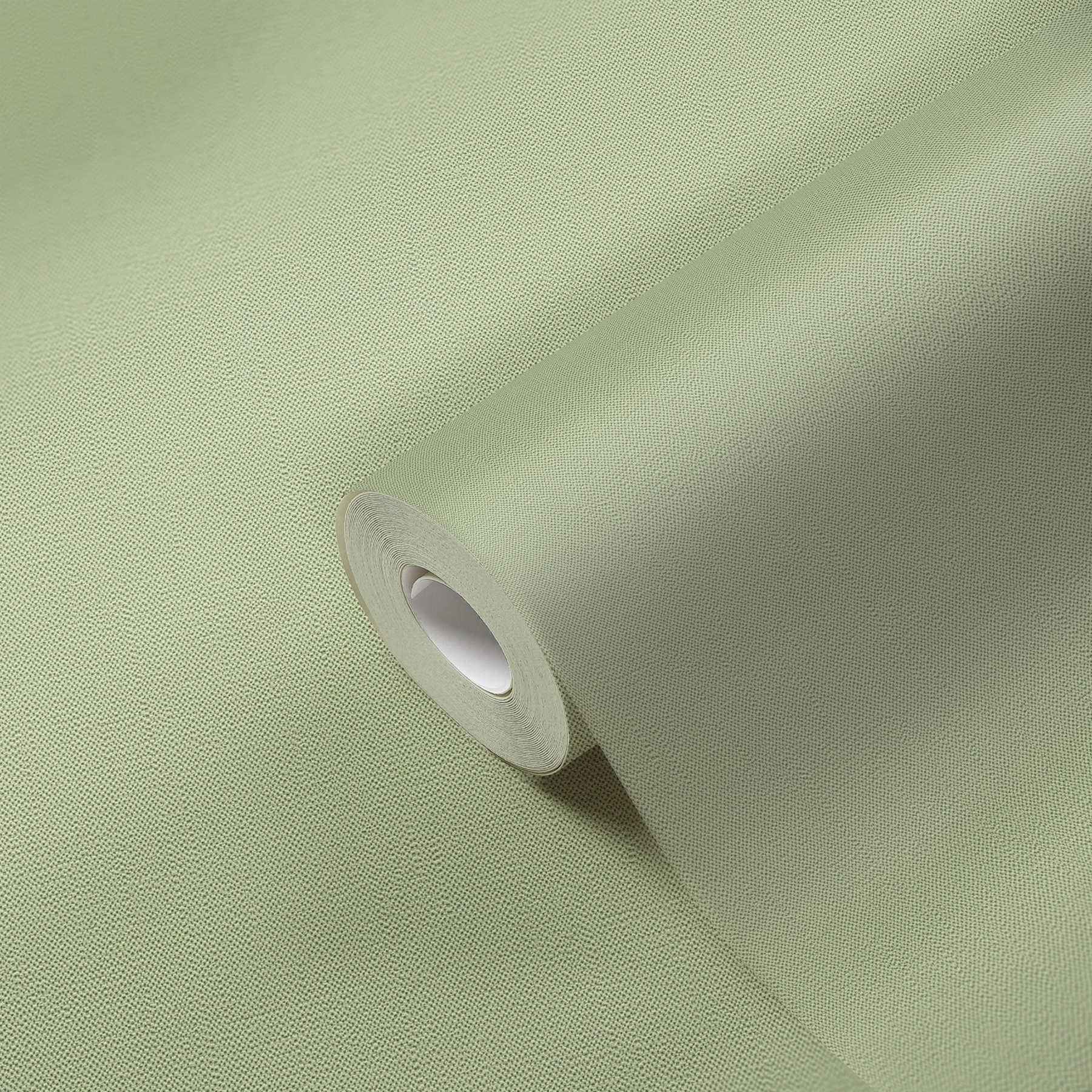            Non-woven wallpaper mint green with foam structure in linen look
        