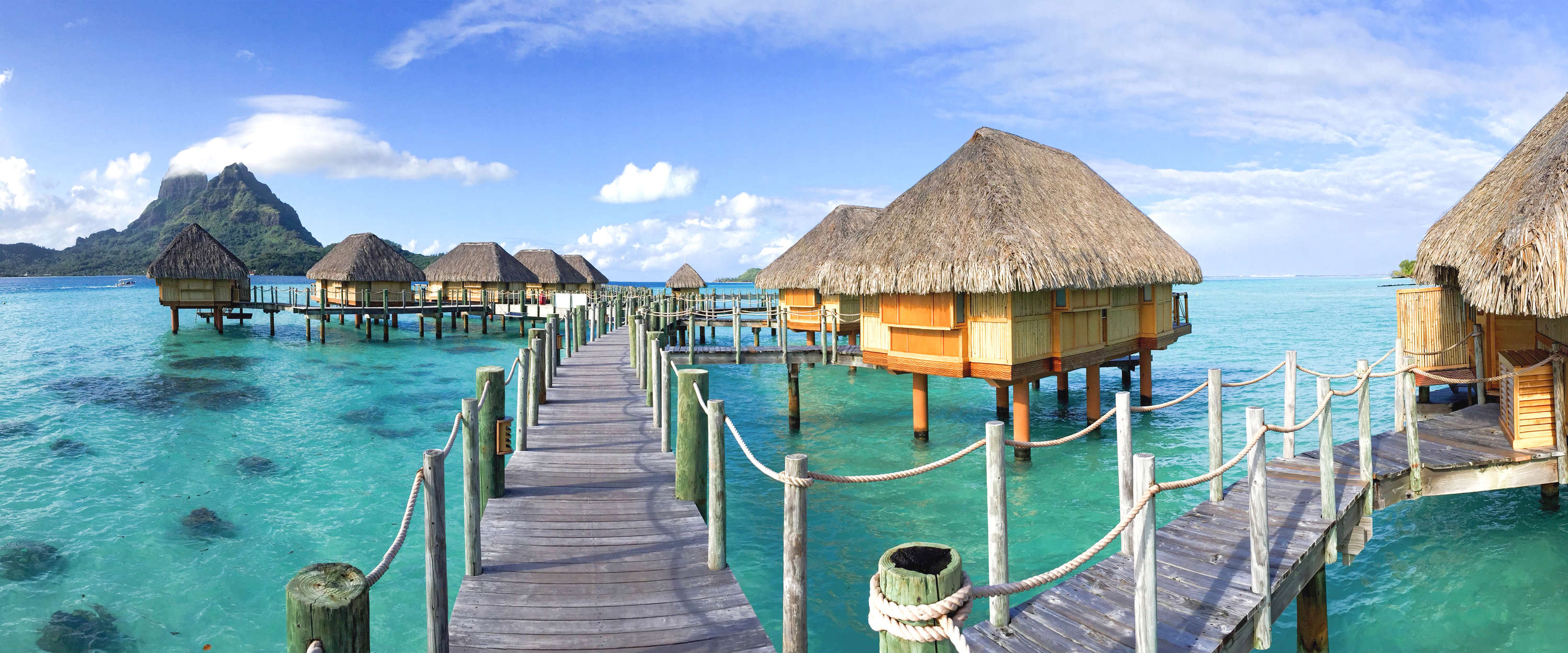             Exotic photo wallpaper Thaiti bungalows in the water
        