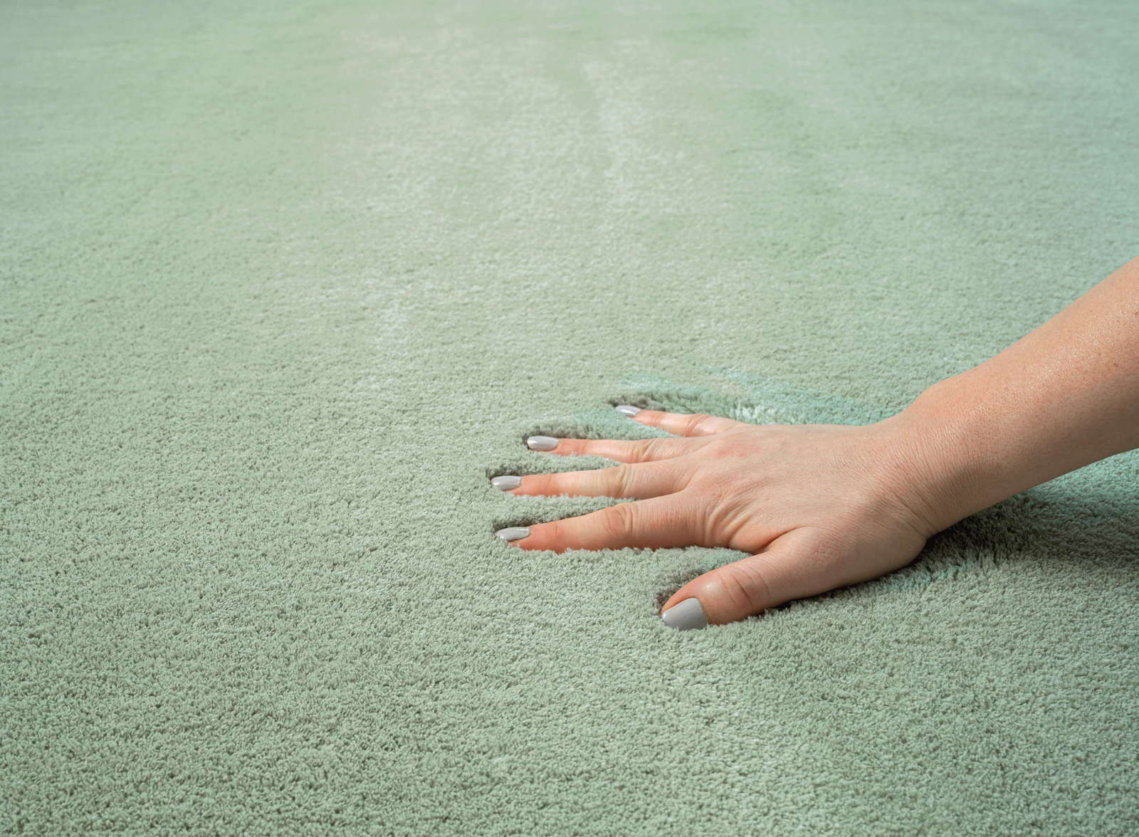             Soft pile carpet in green - 110 x 60 cm
        