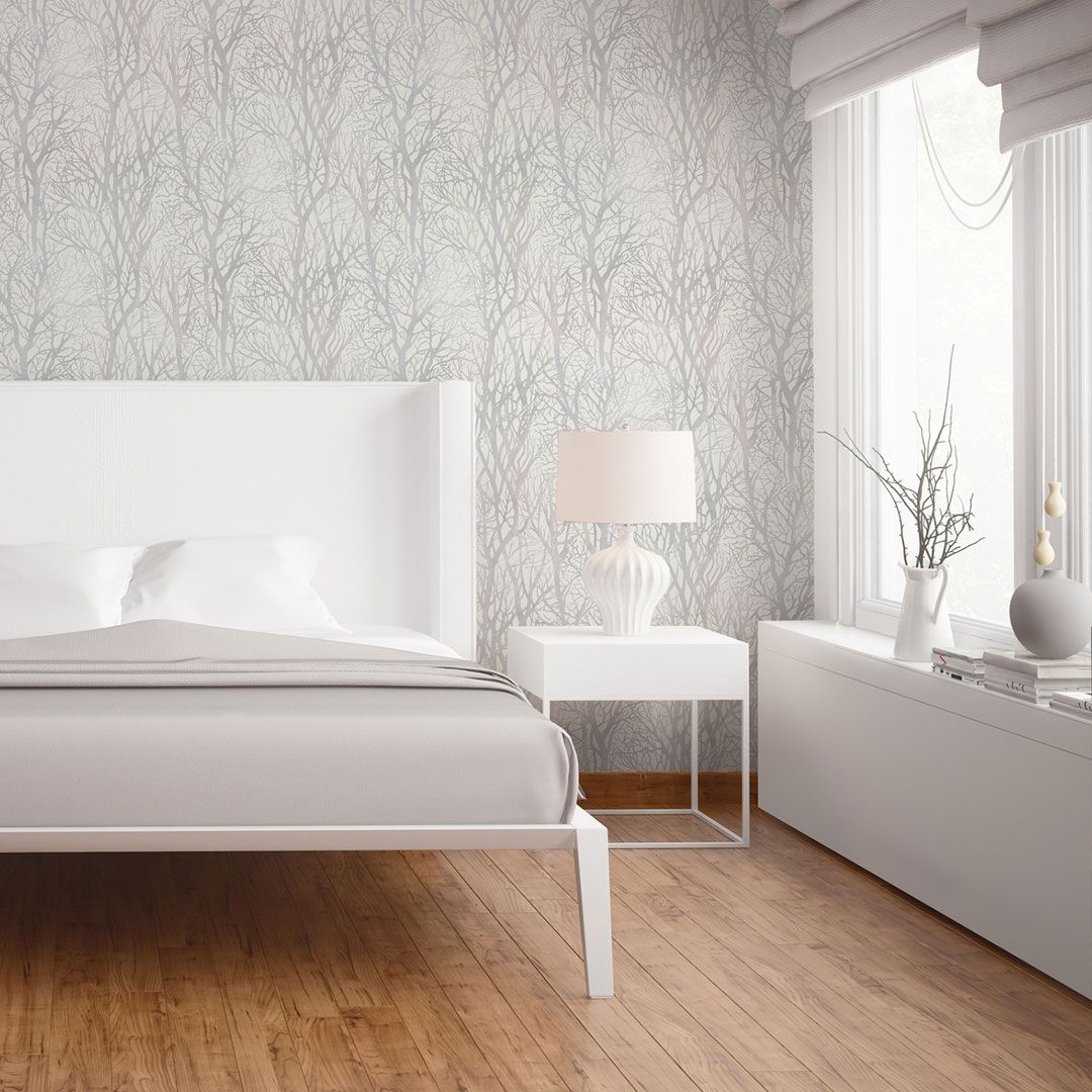 Wallpapered bedroom bathed in sunlight AS300941
