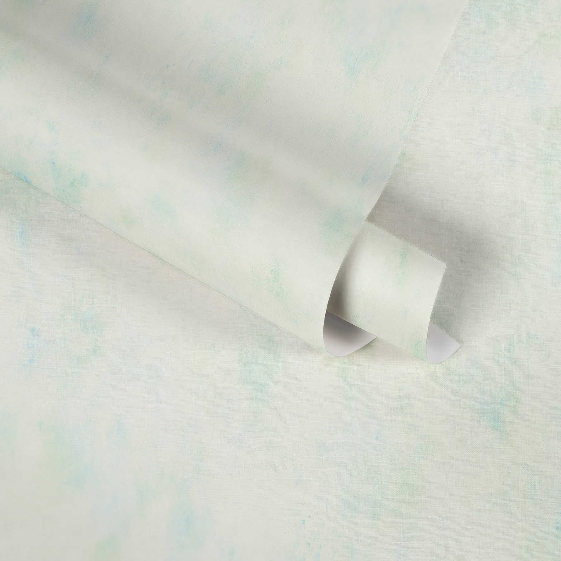             Non-woven wallpaper cream with cloudy colour effect in green
        