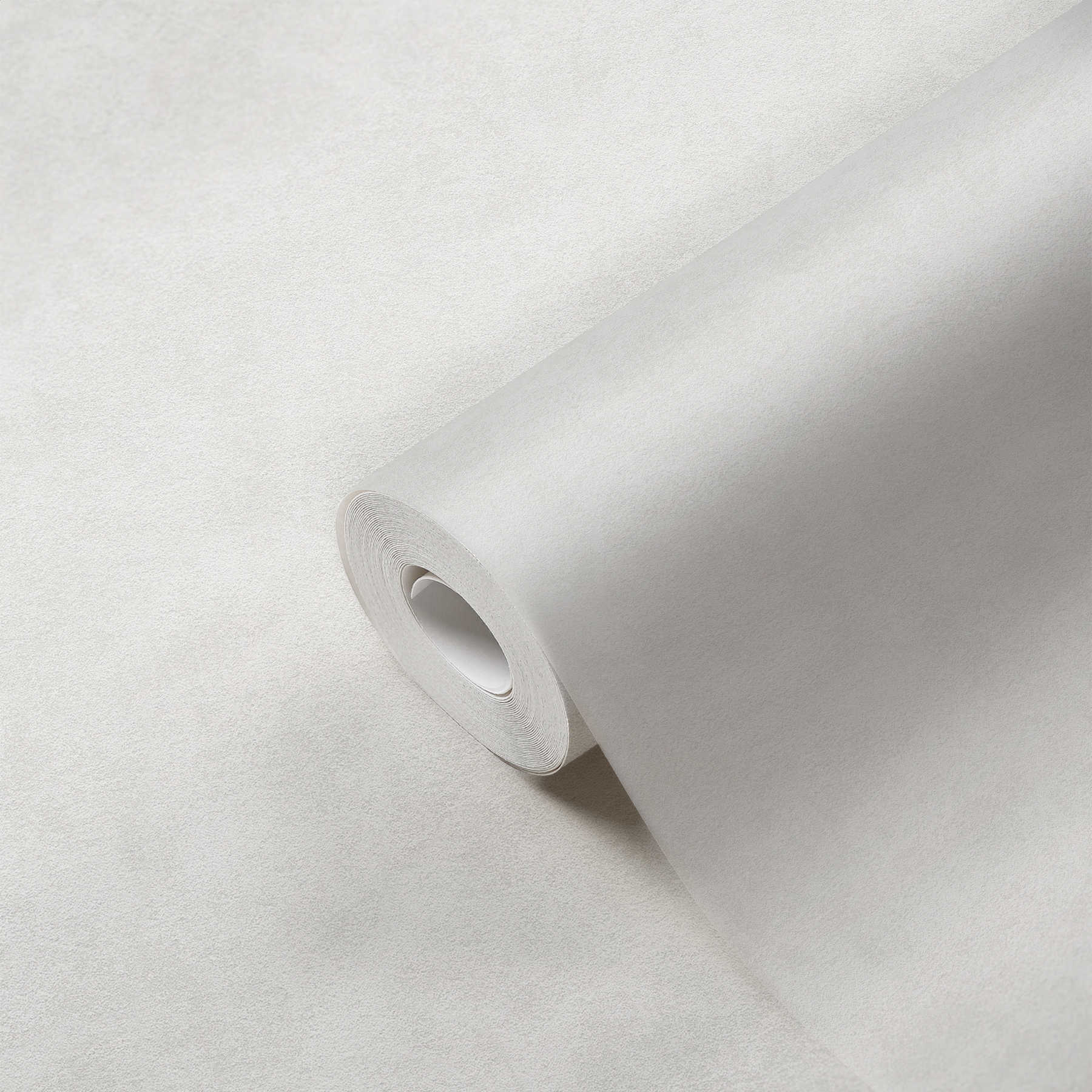             Papier peint uni crème beige avec motifs structurés neutres
        
