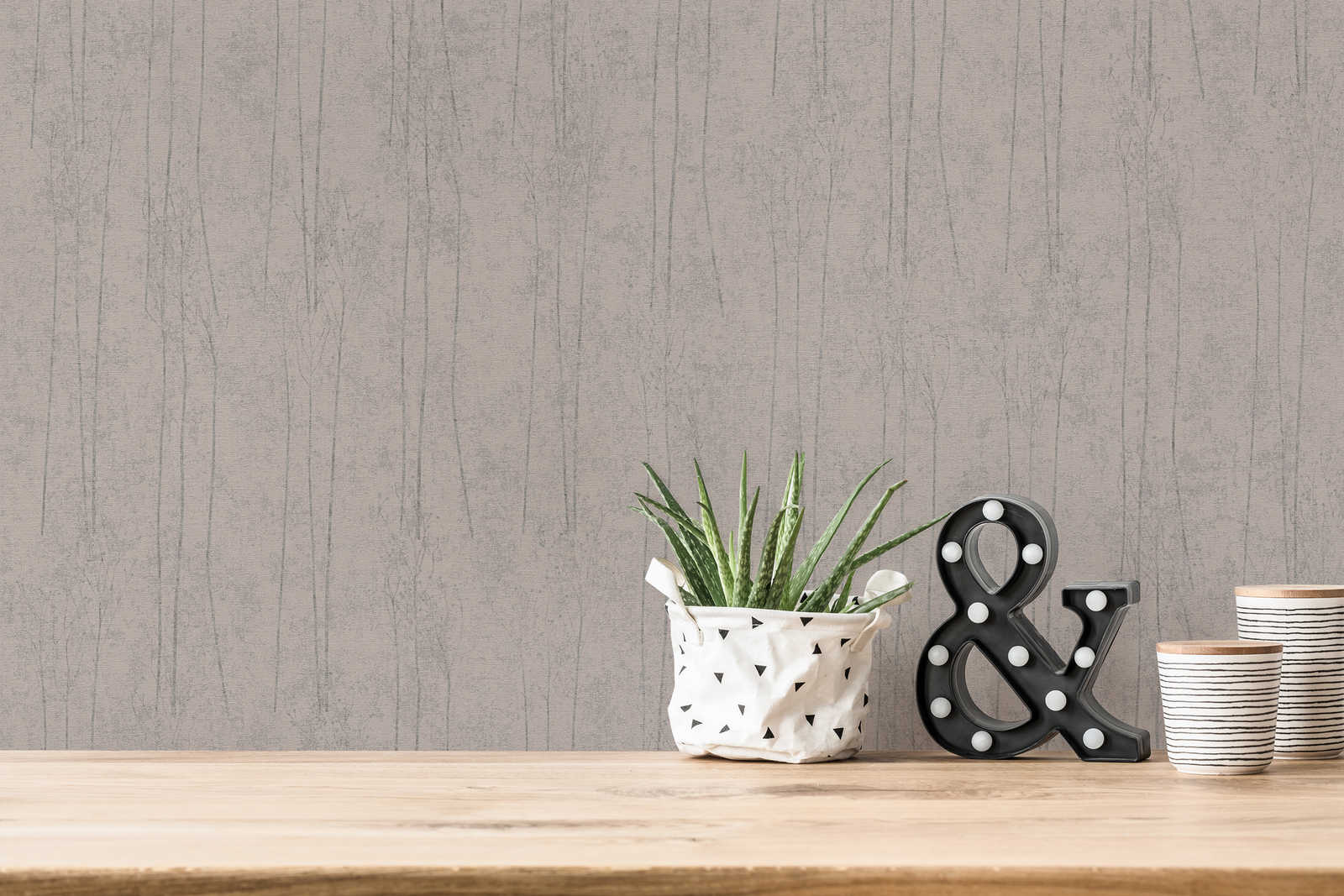             Grey non-woven wallpaper with nature design in Scandi style
        