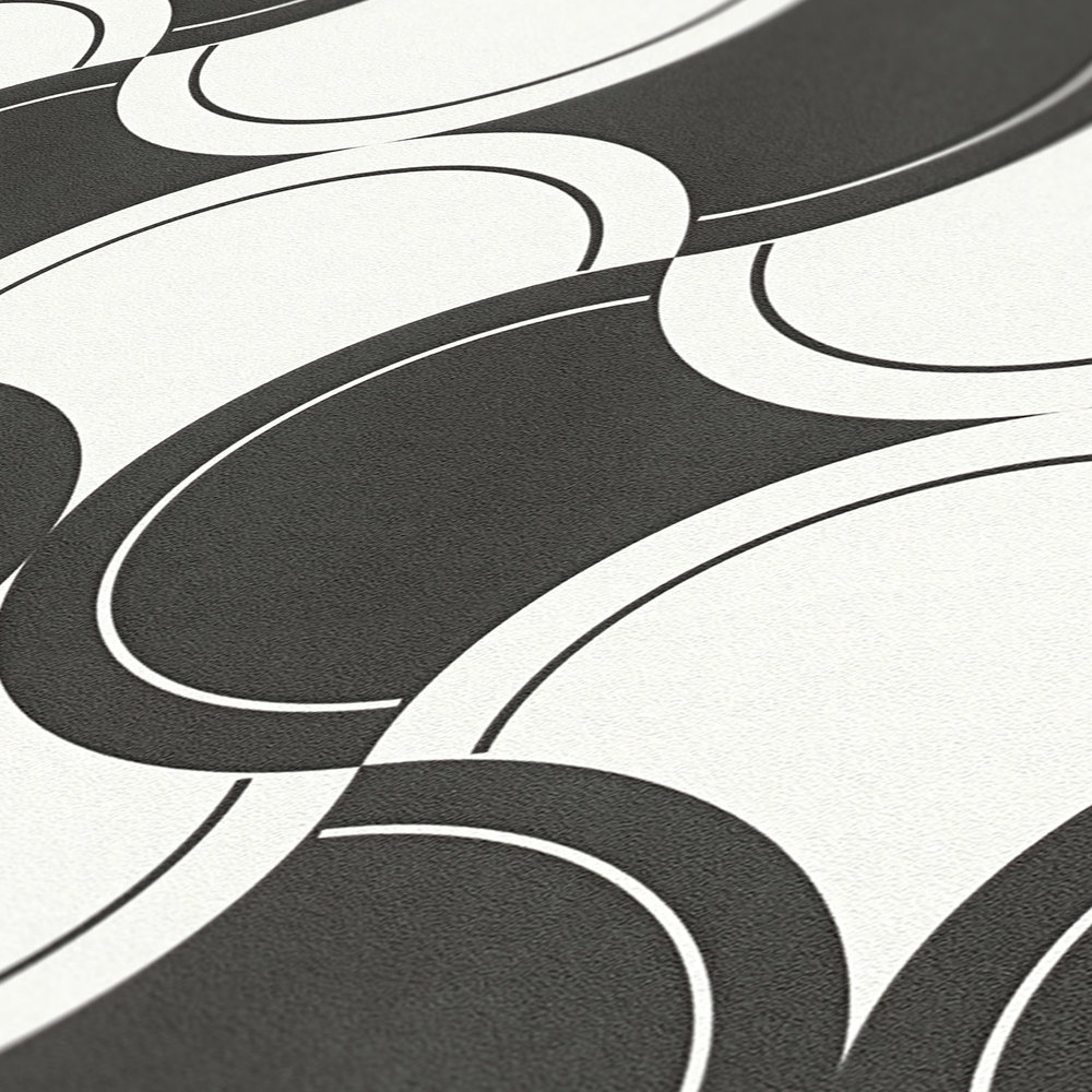             Papier peint intissé motif rétro avec cercles style années 70 - noir et blanc
        