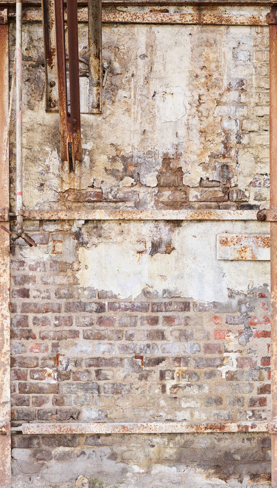             Non-woven wallpaper old brick wall with rusty metal frame - cream, brown, beige
        