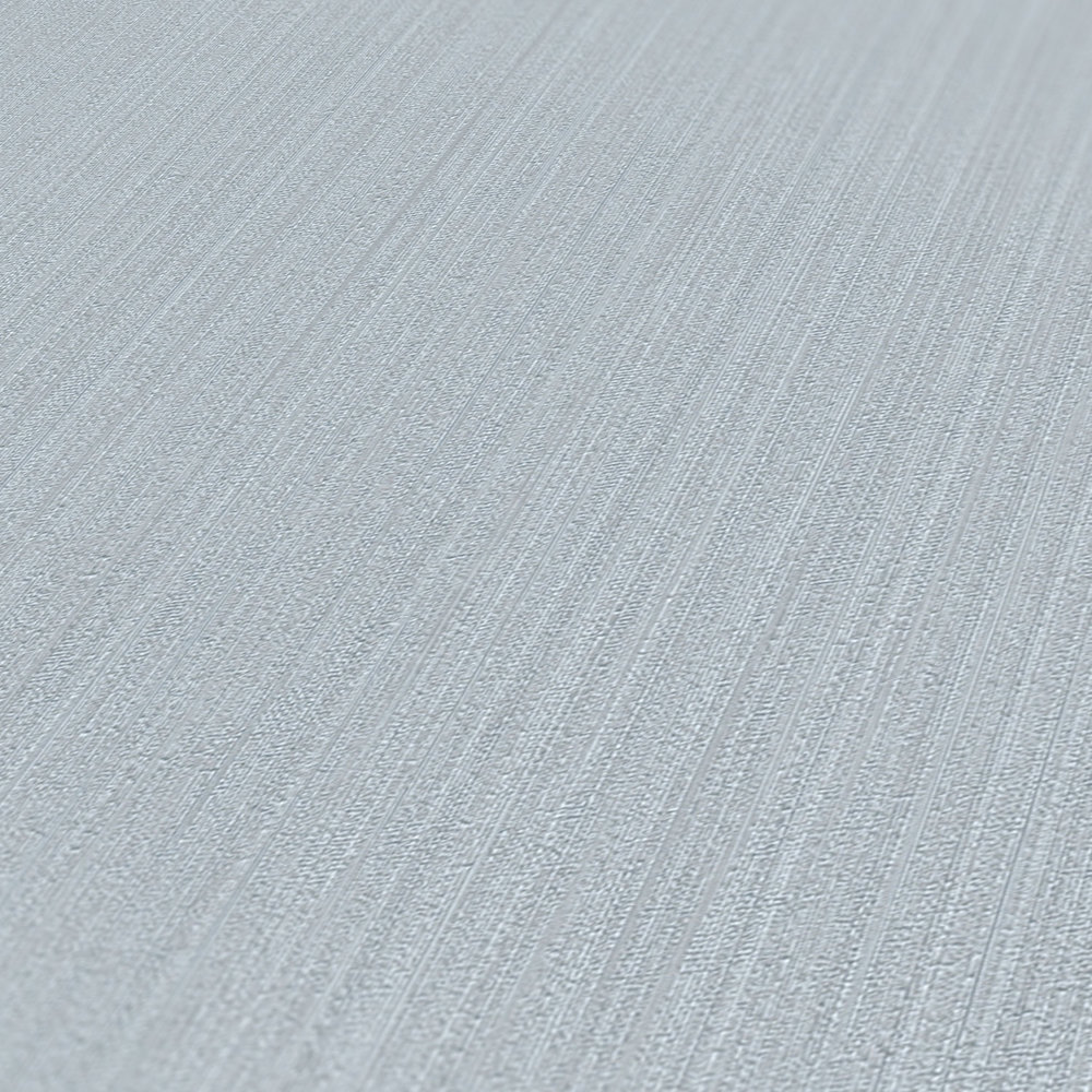            Papel pintado no tejido de seda gris paloma mate, liso con efecto de estructura
        