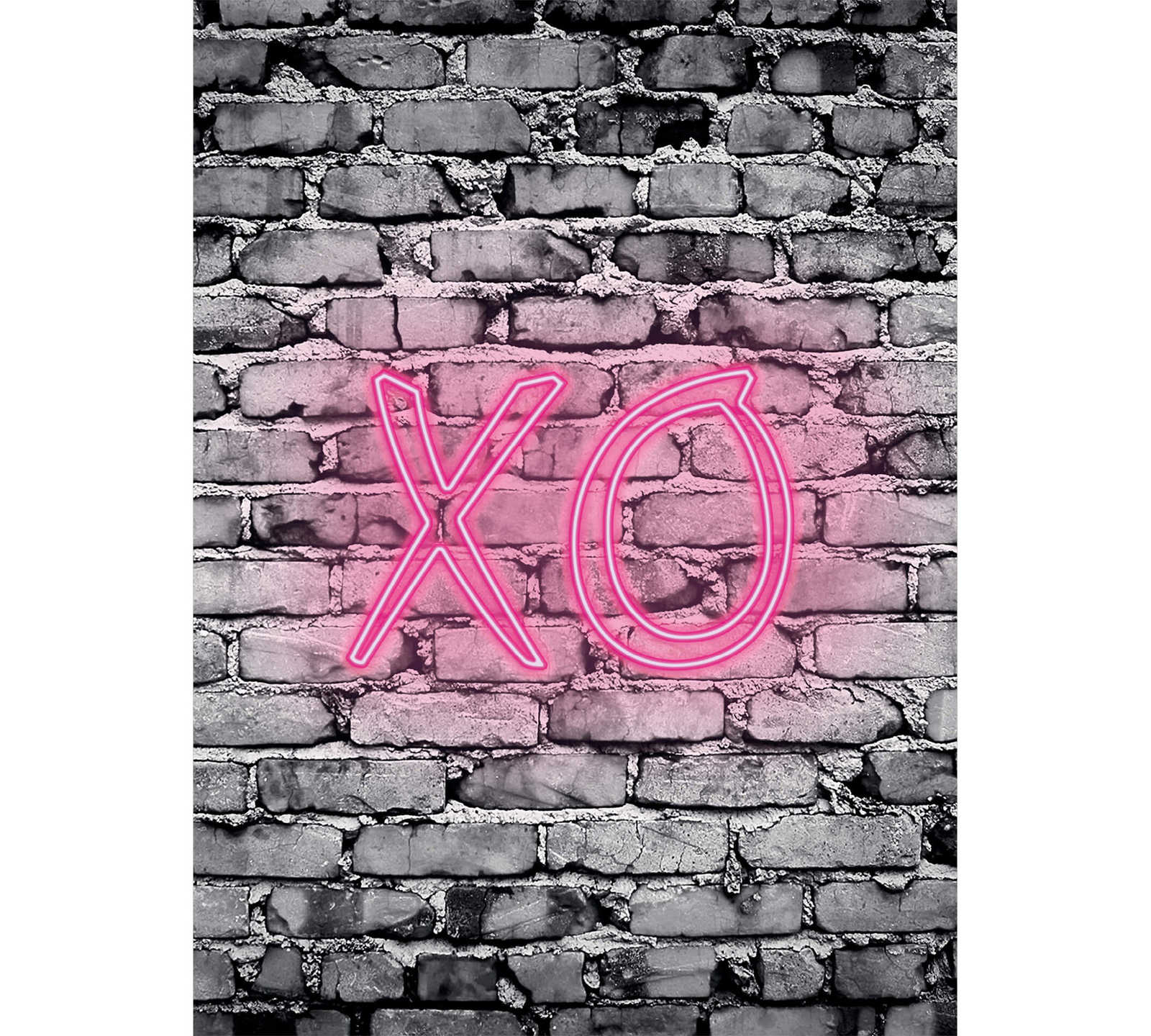         narrow mural illuminated letters XO on stone wall
    