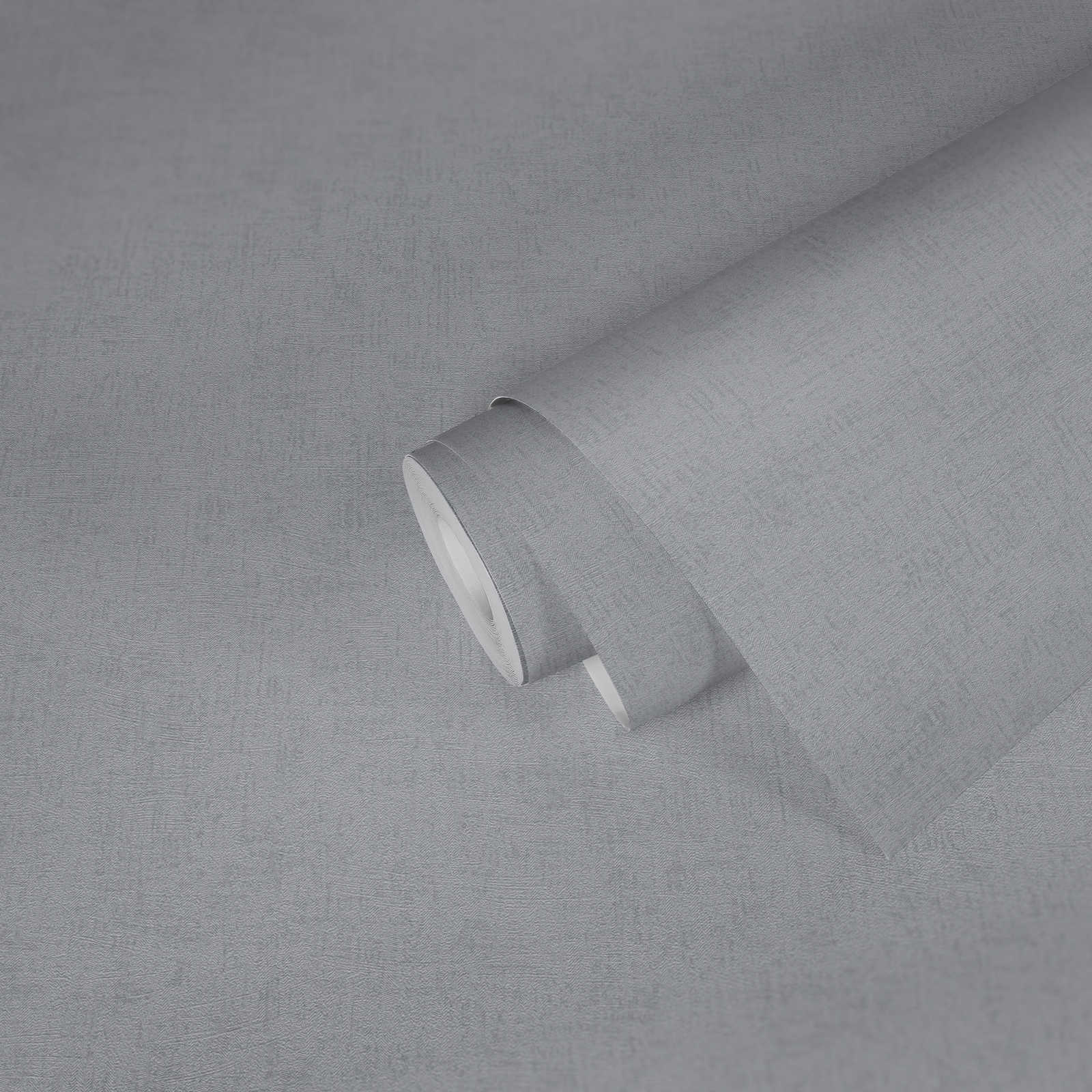             Papier peint chiné gris uni avec éclat métallique
        