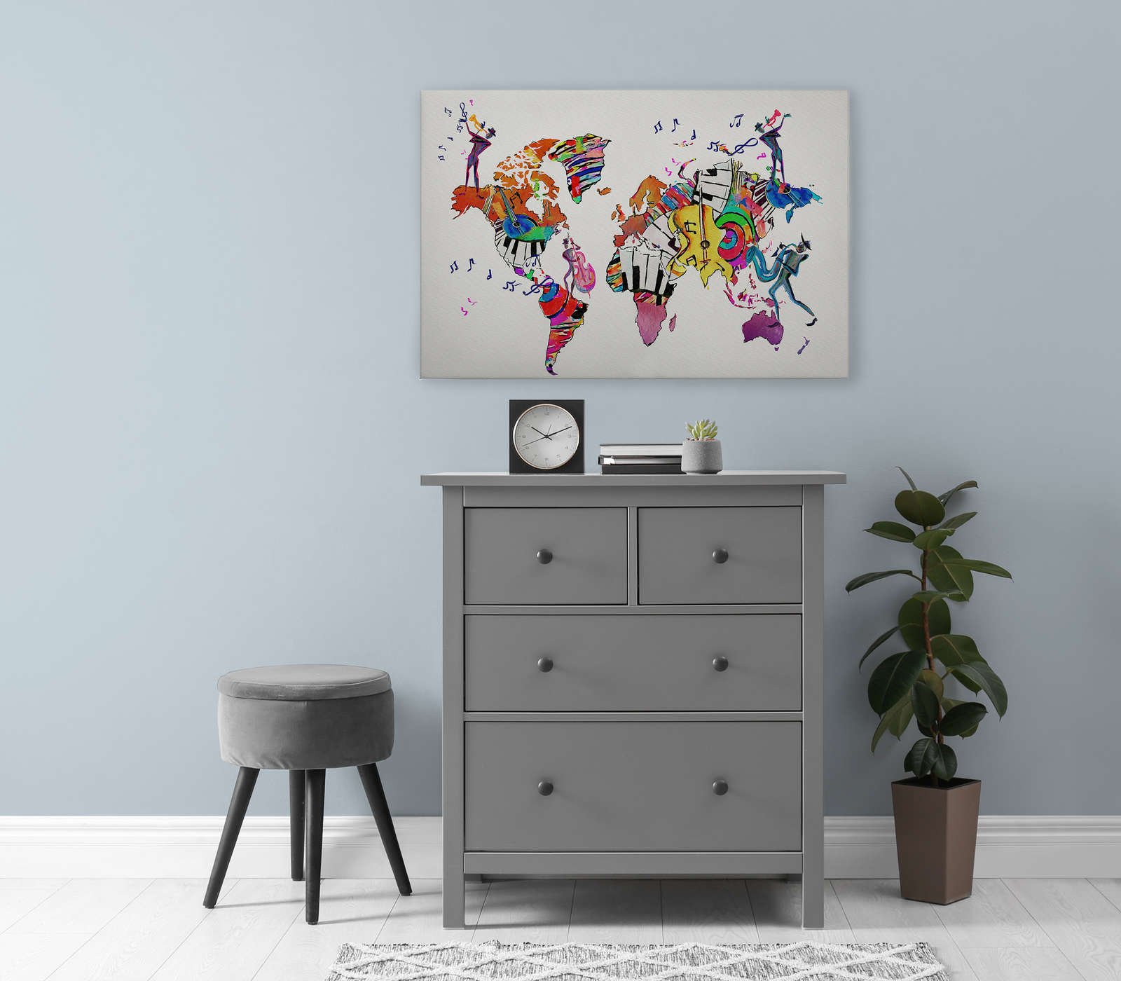             Canvas painting with world map filled with instruments and clefs - 0.90 m x 0.60 m
        