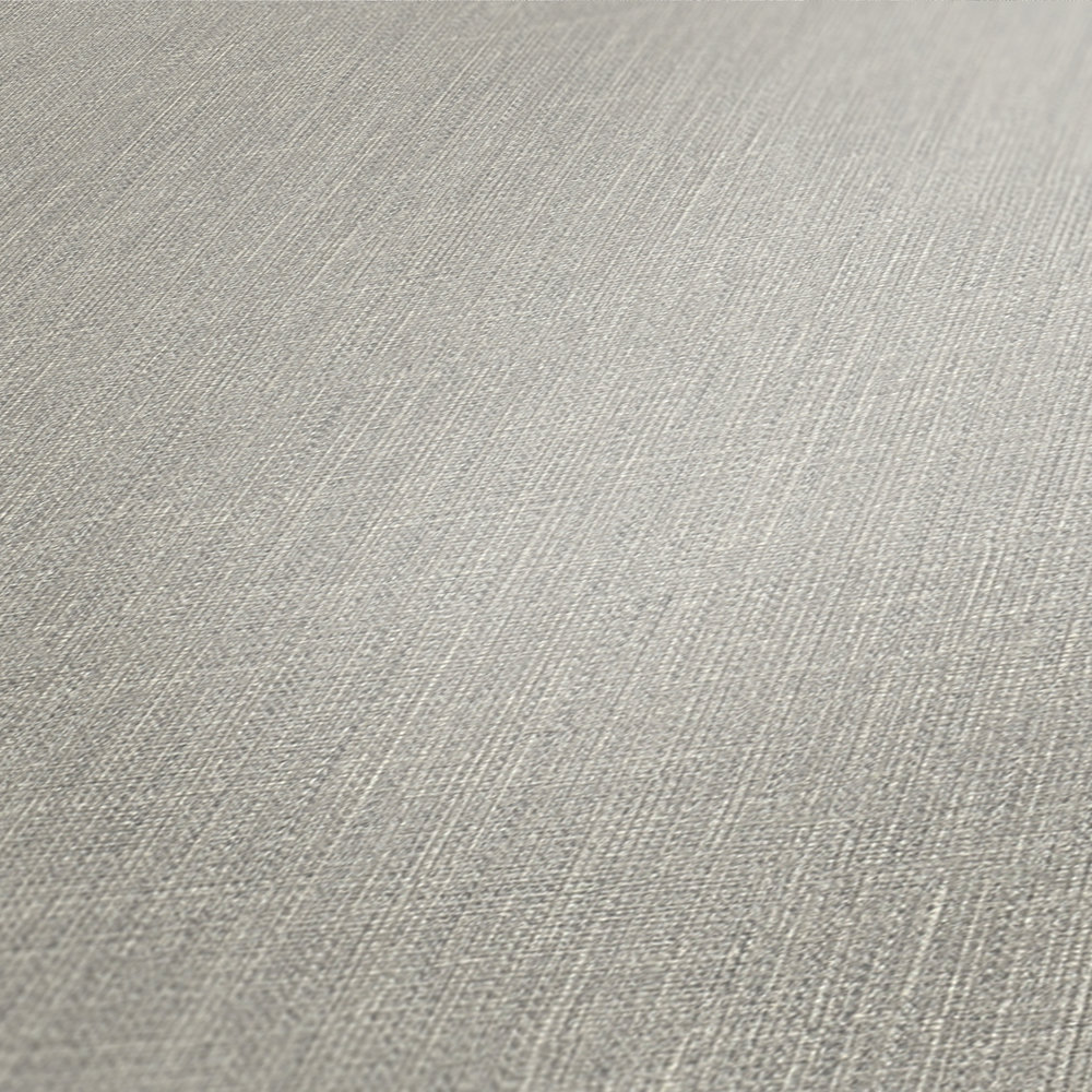             Vliesbehang grijs met textiellook & structuurpatroon
        