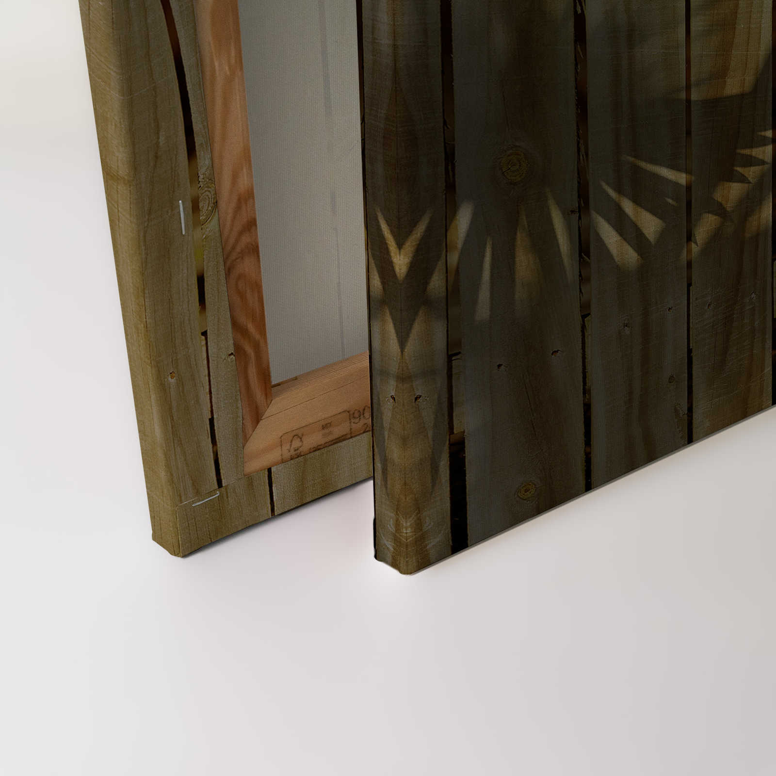             Canvas schilderij met houtlook en schaduw van palmbladeren - 0,90 m x 0,60 m
        