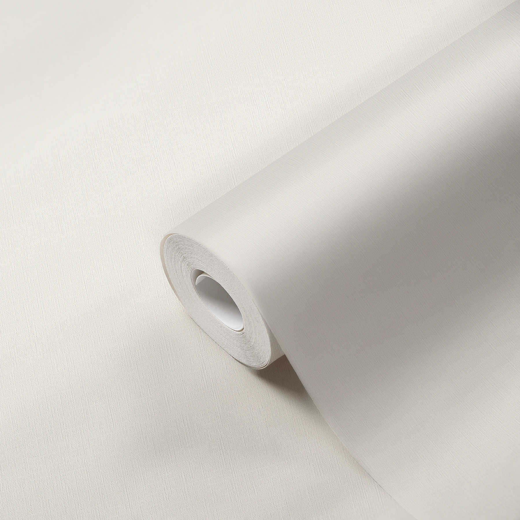             Plain wallpaper non-woven, muted white with satin finish
        