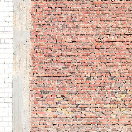 Photo wallpaper with red clinker bricks and exposed concrete columns
