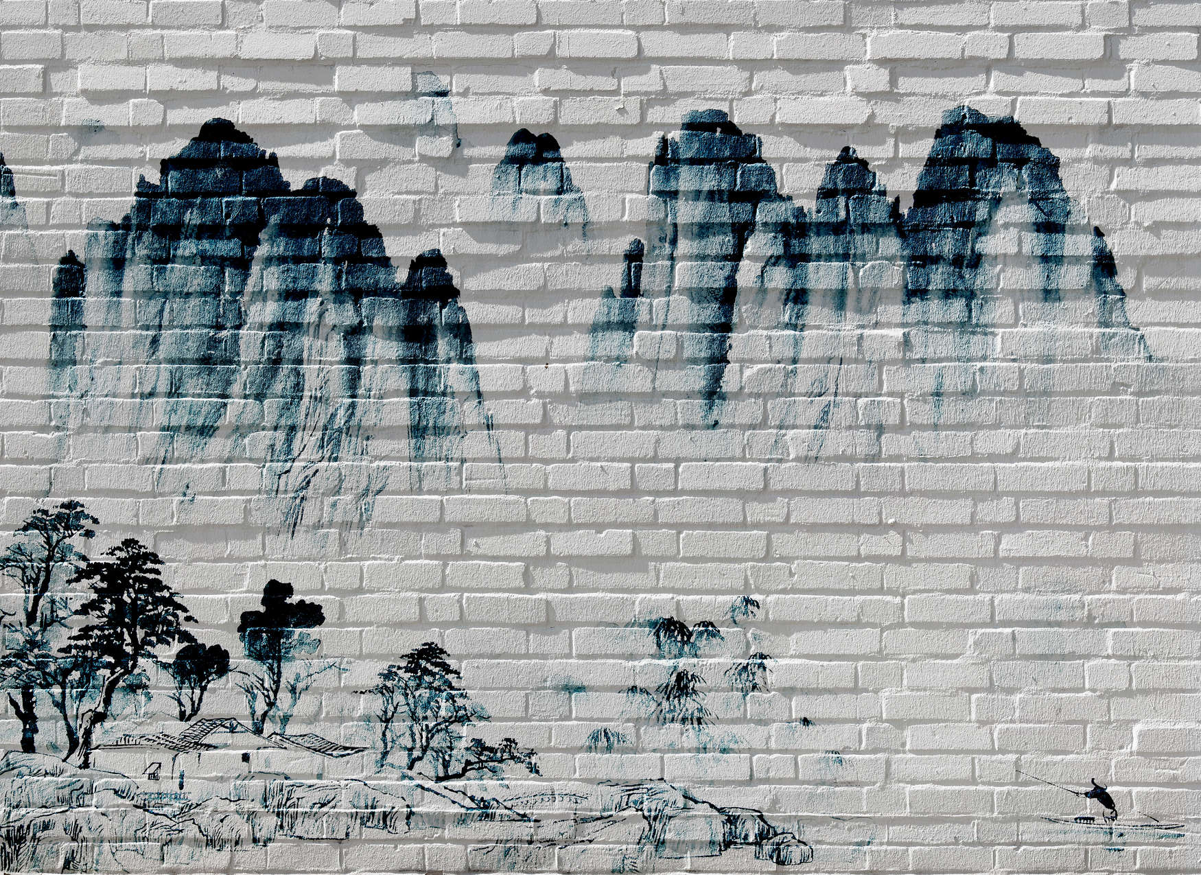             Papier peint panoramique Montagnes sur mur de briques - bleu, blanc
        