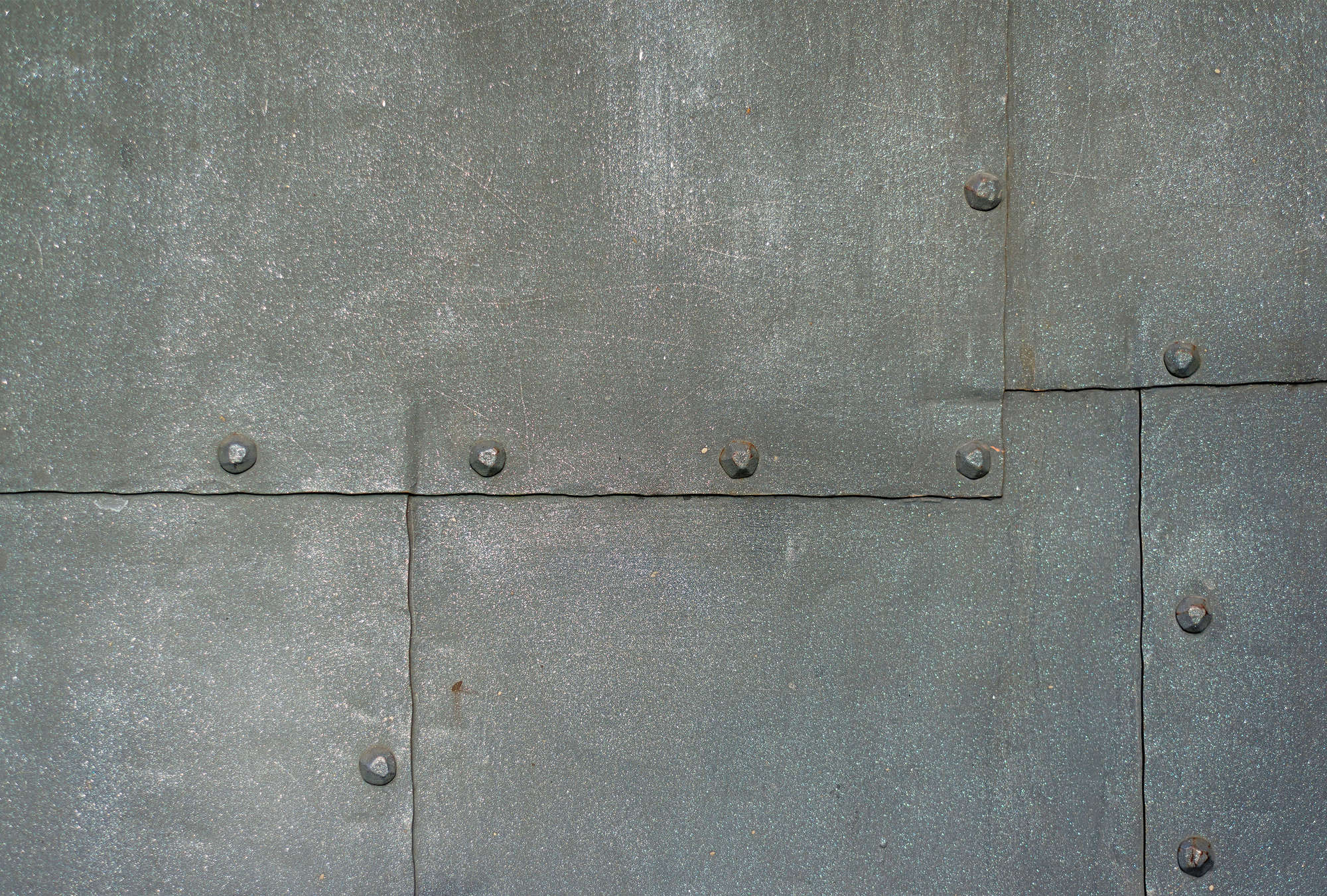             Carta da parati metallica Piastre e rivetti in acciaio grigio
        