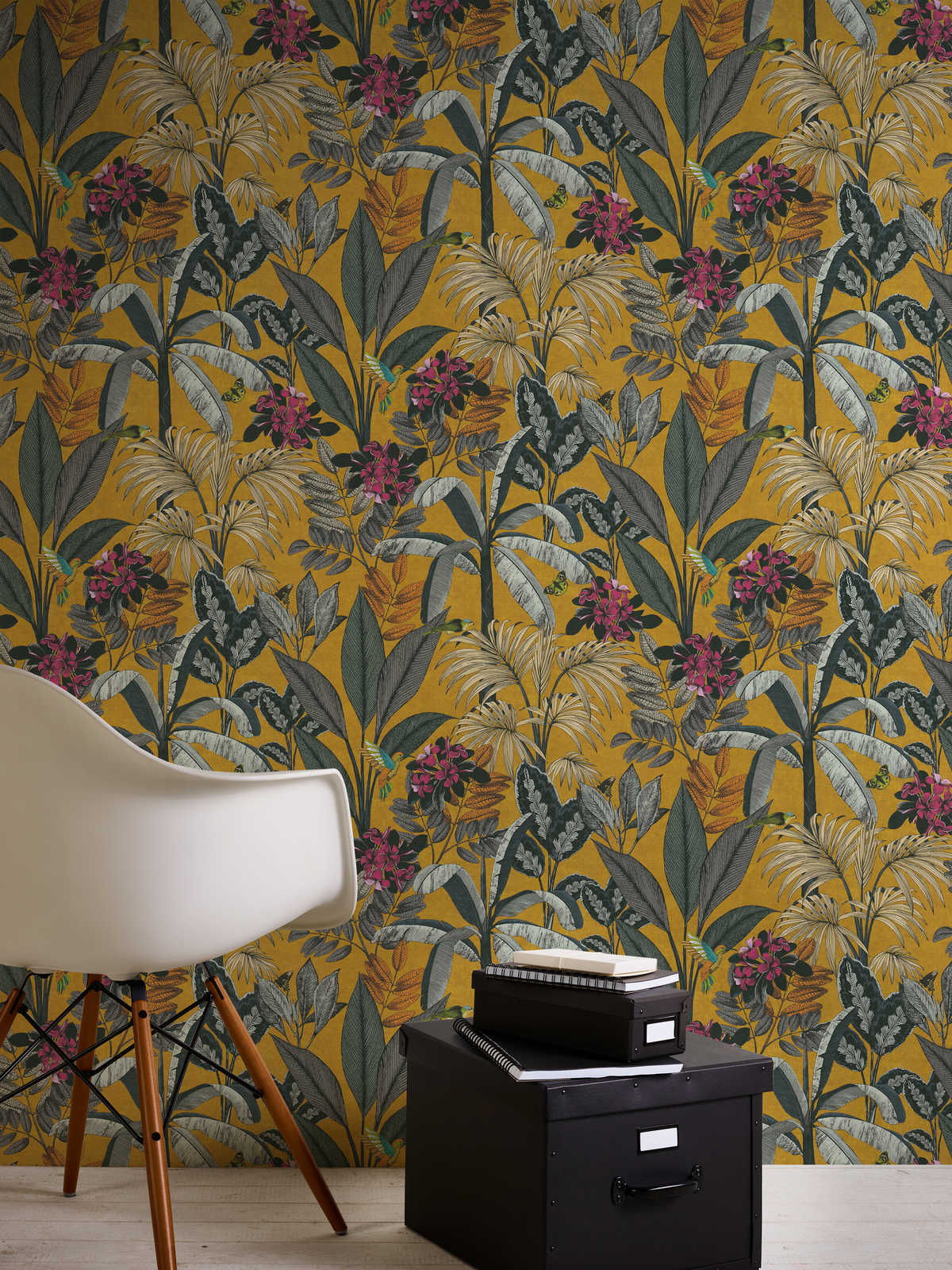             Mustard yellow wallpaper with tropical leaves and flowers pattern
        